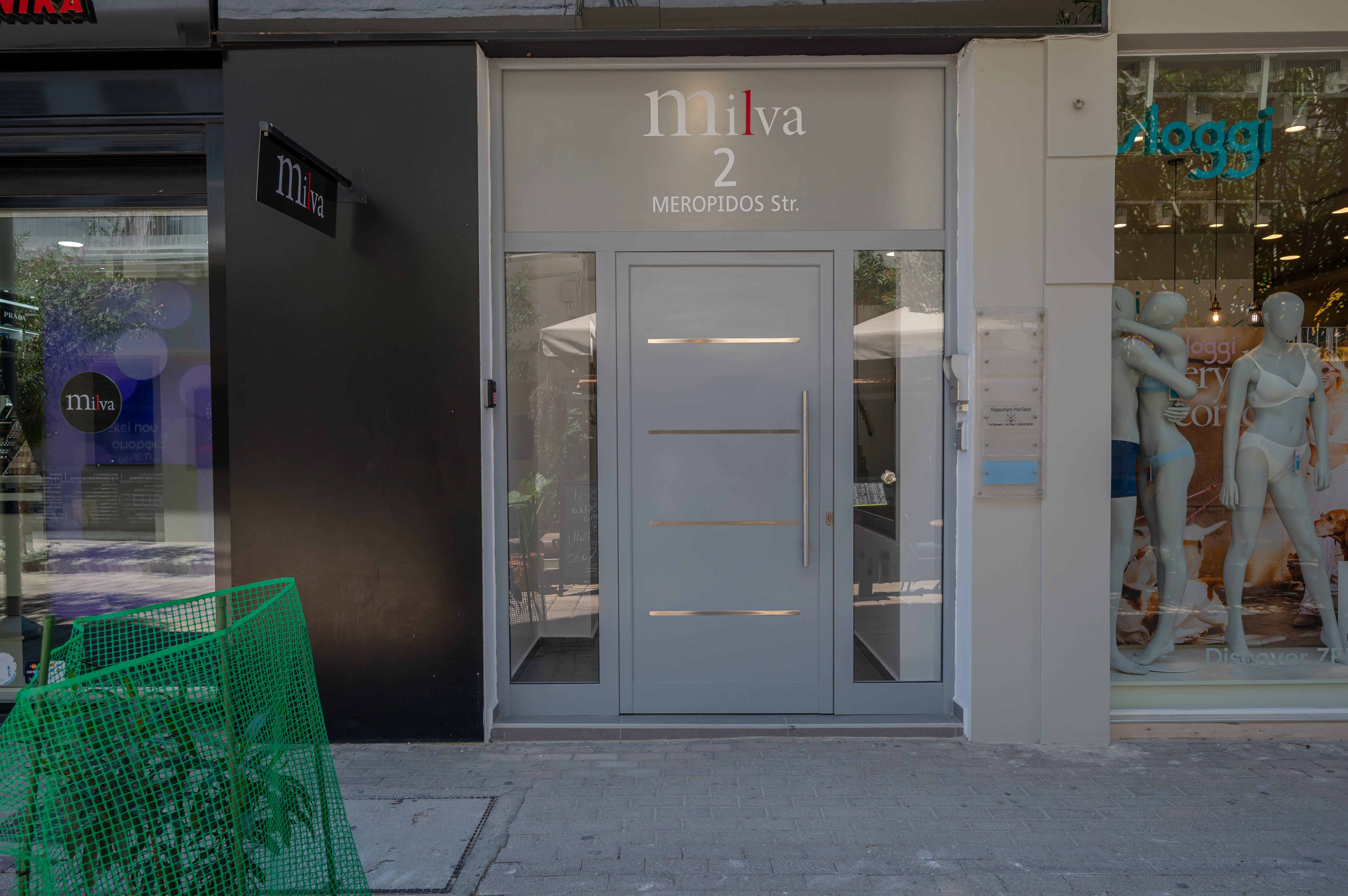 a grey door with glass panels