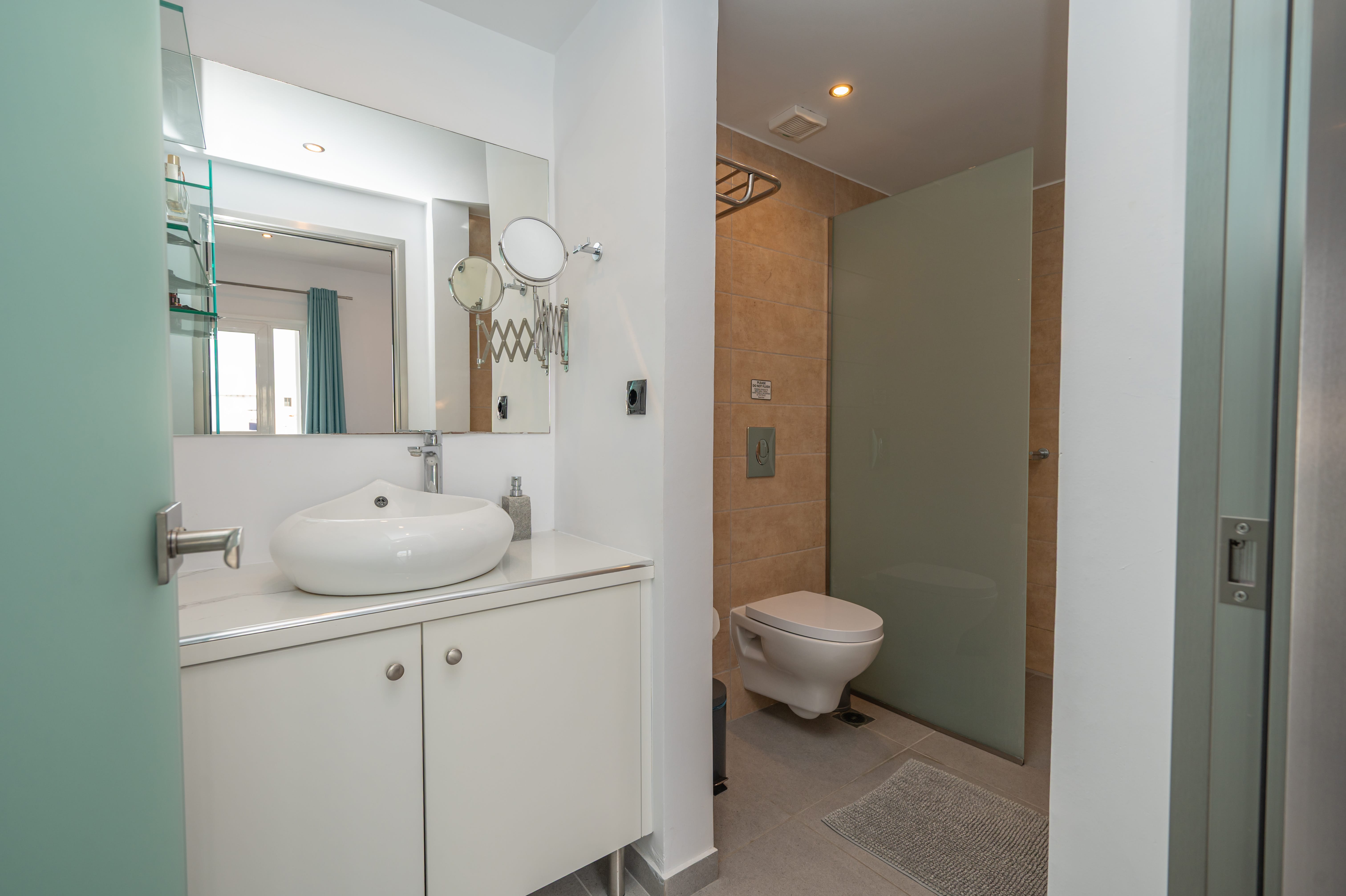 a bathroom with a sink and toilet
