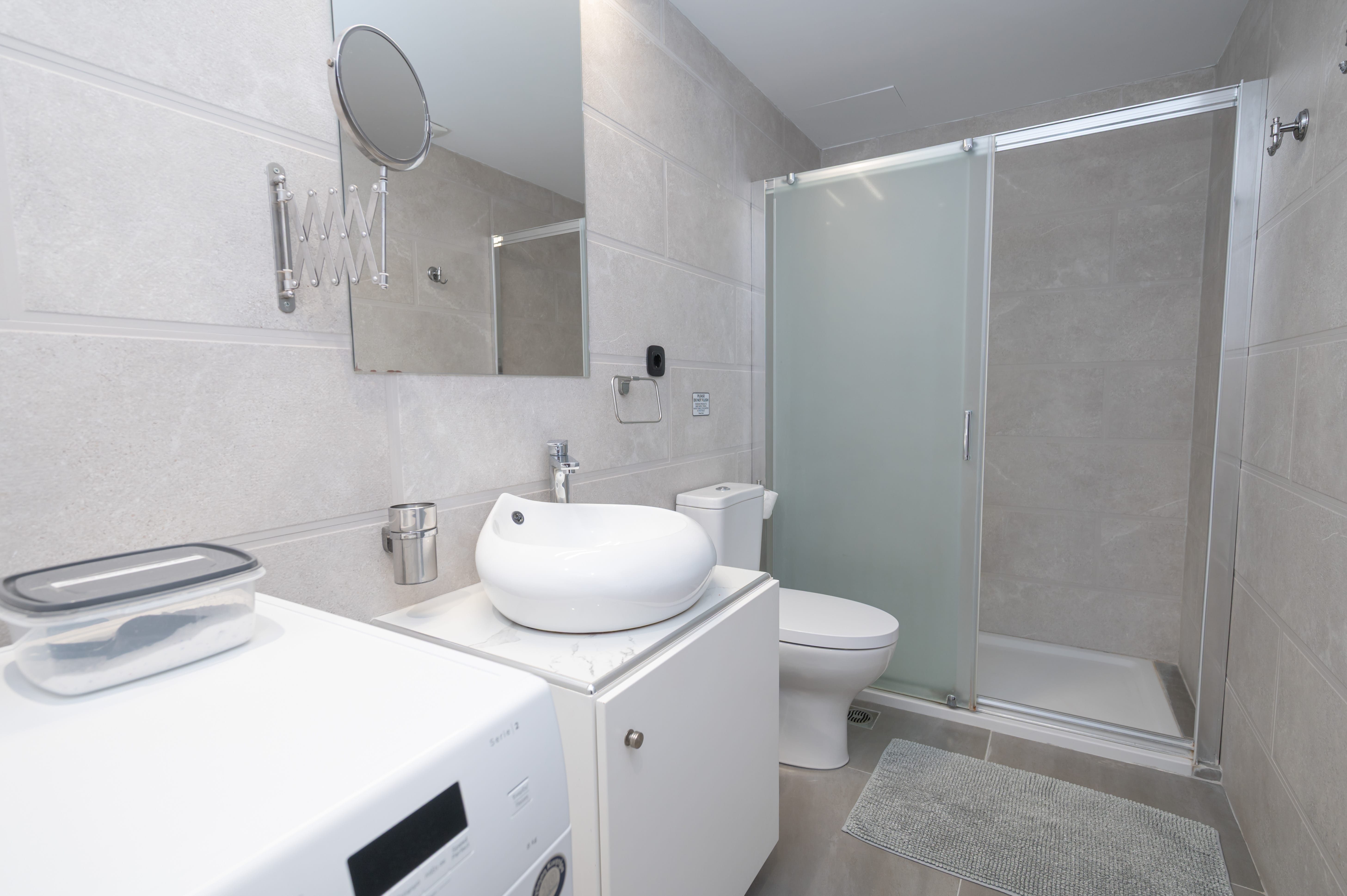 a bathroom with a sink and a washer