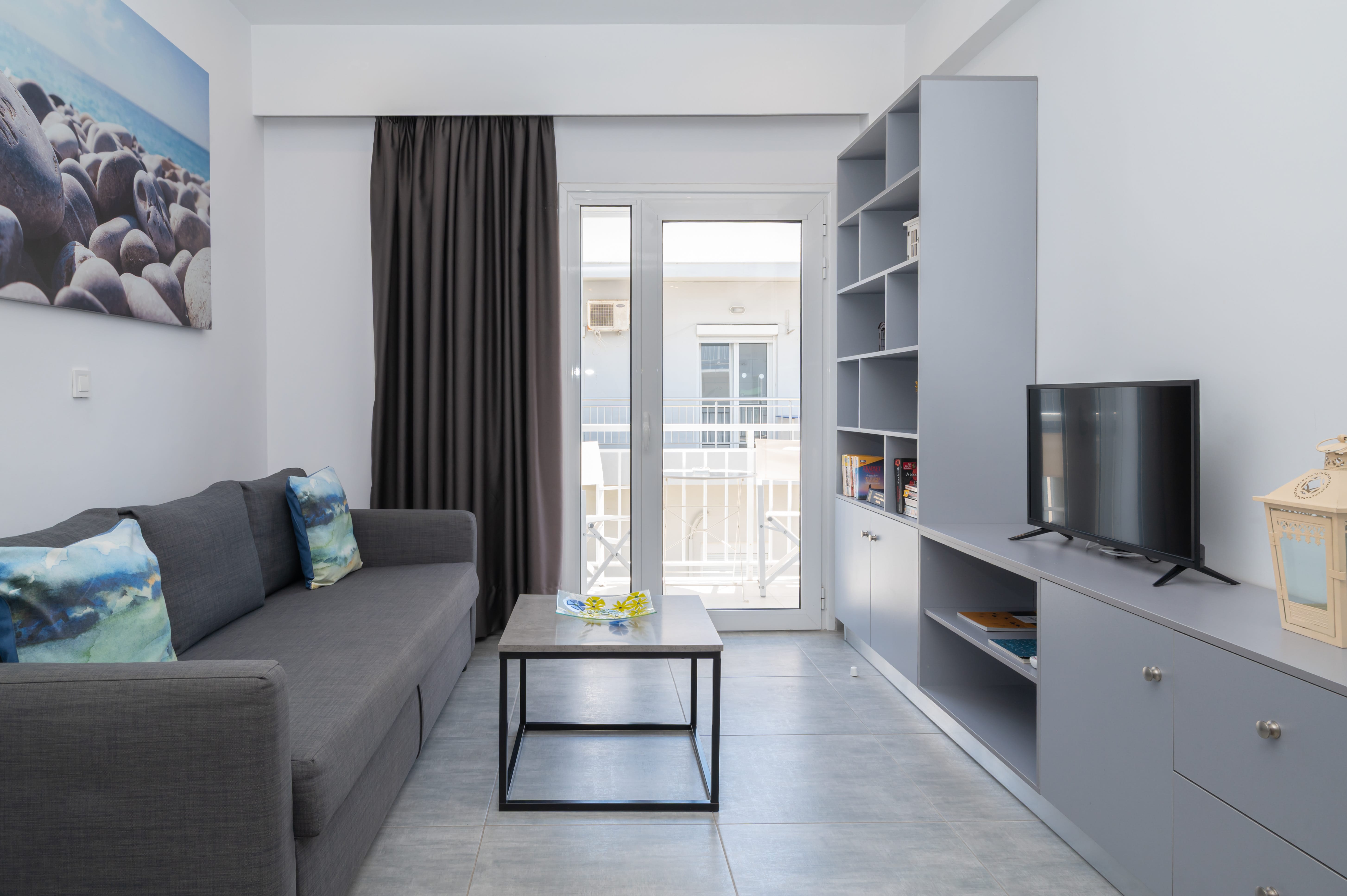 a living room with a couch and a tv