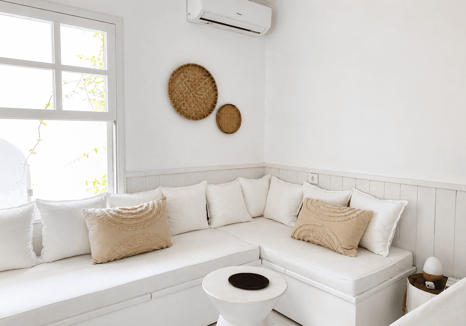 a white couch with pillows