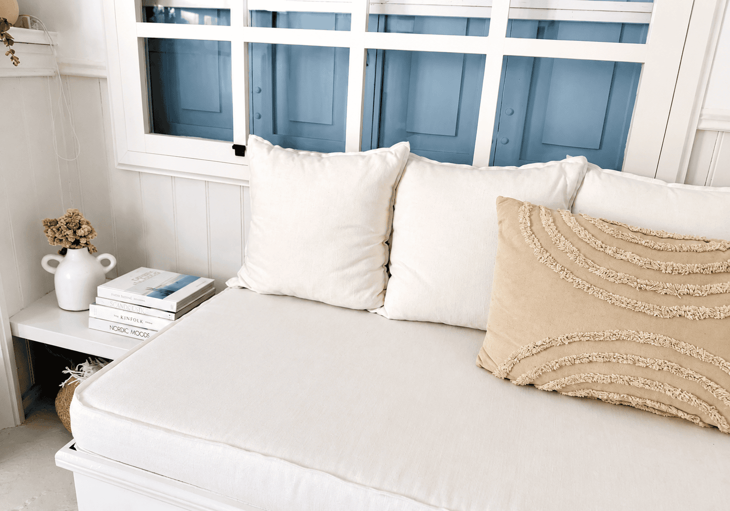a bed with white pillows