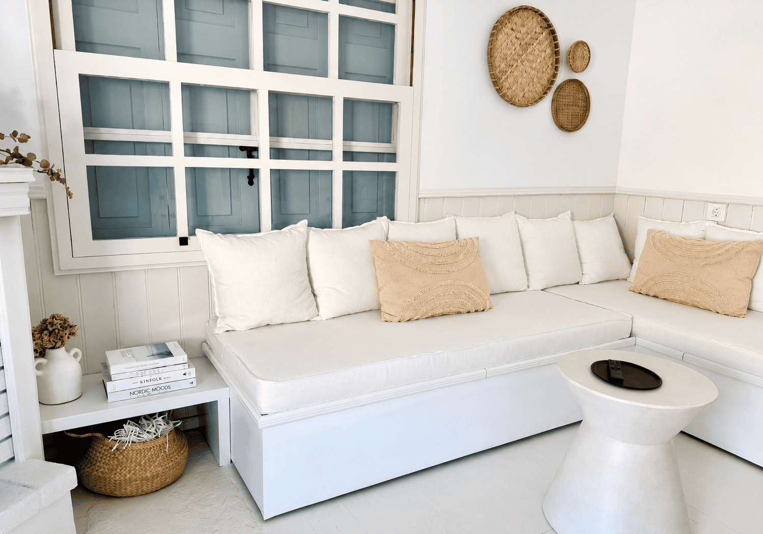 a white couch with pillows