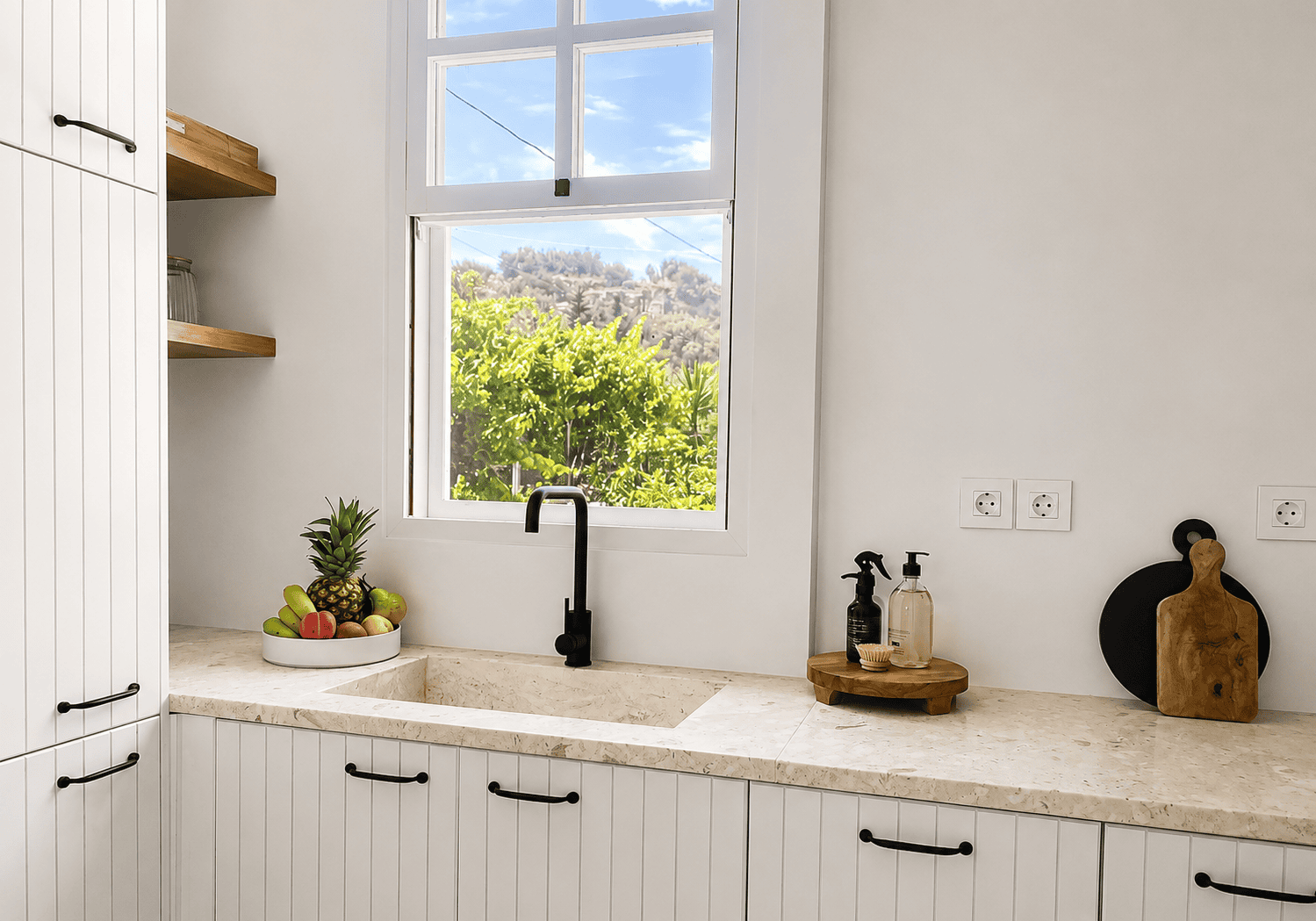 a kitchen with a sink and a window