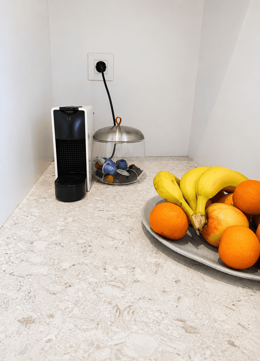 a bowl of fruit on a counter