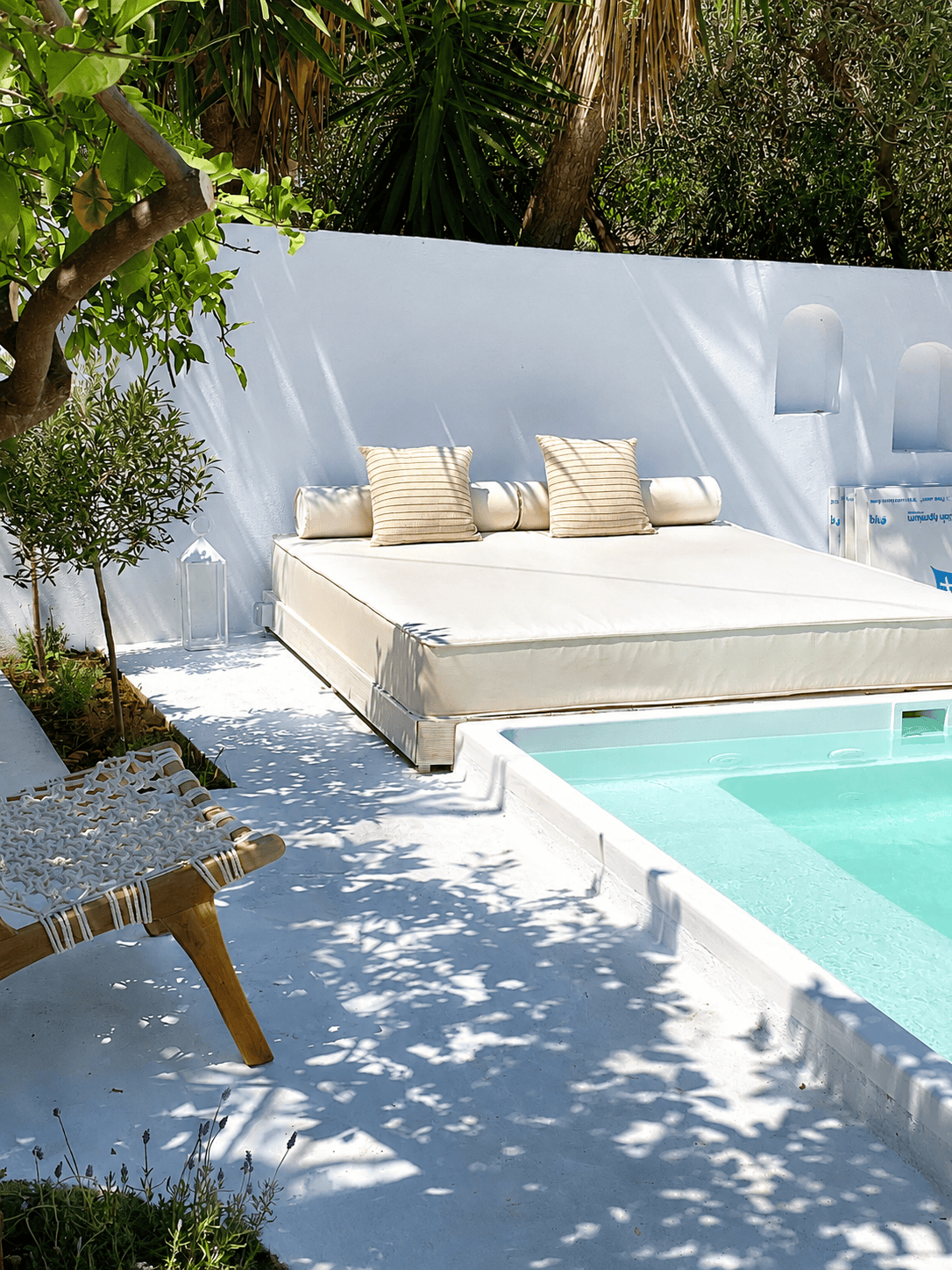 a white couch and a pool