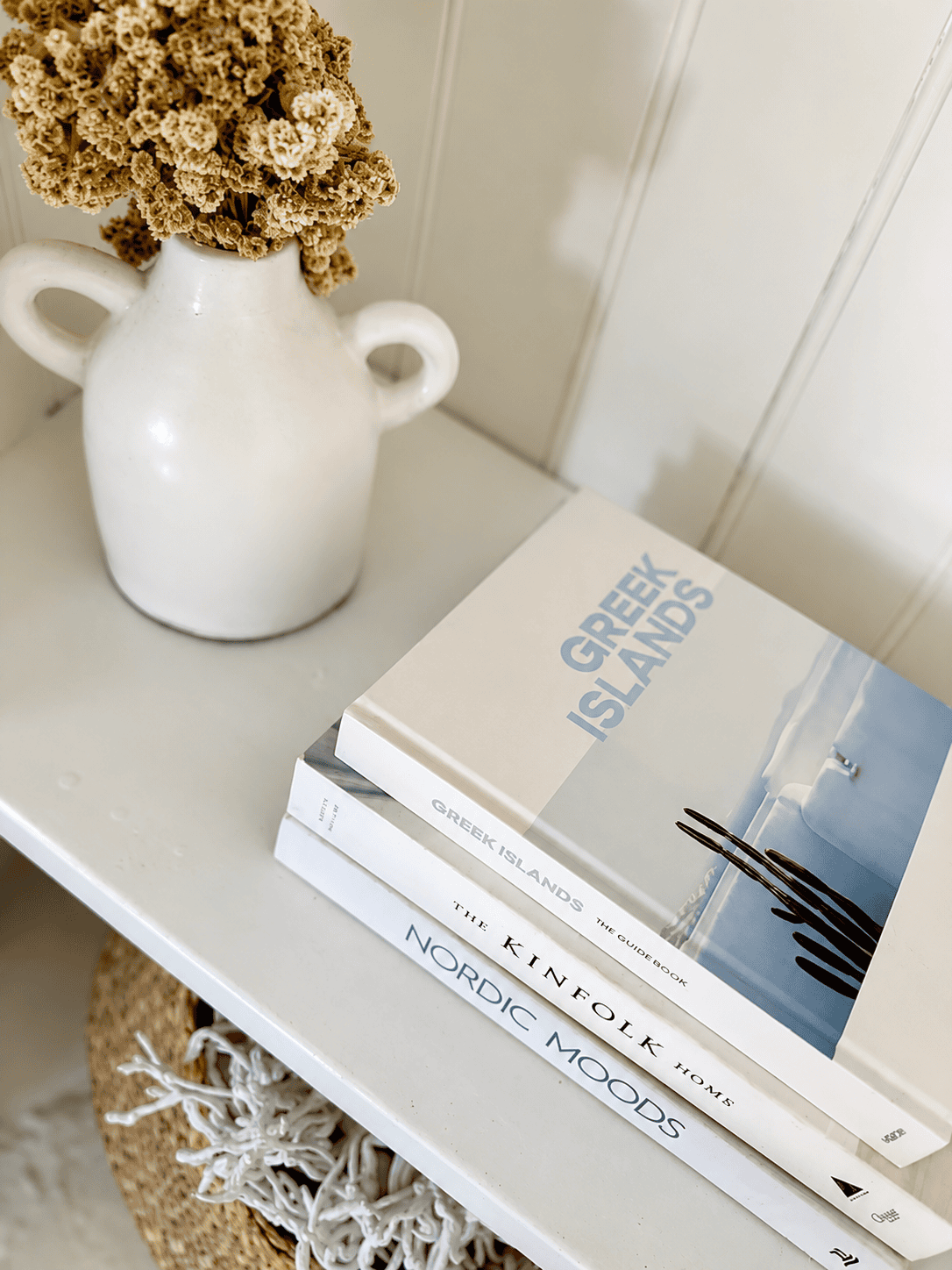 a calendar and a teapot on a counter