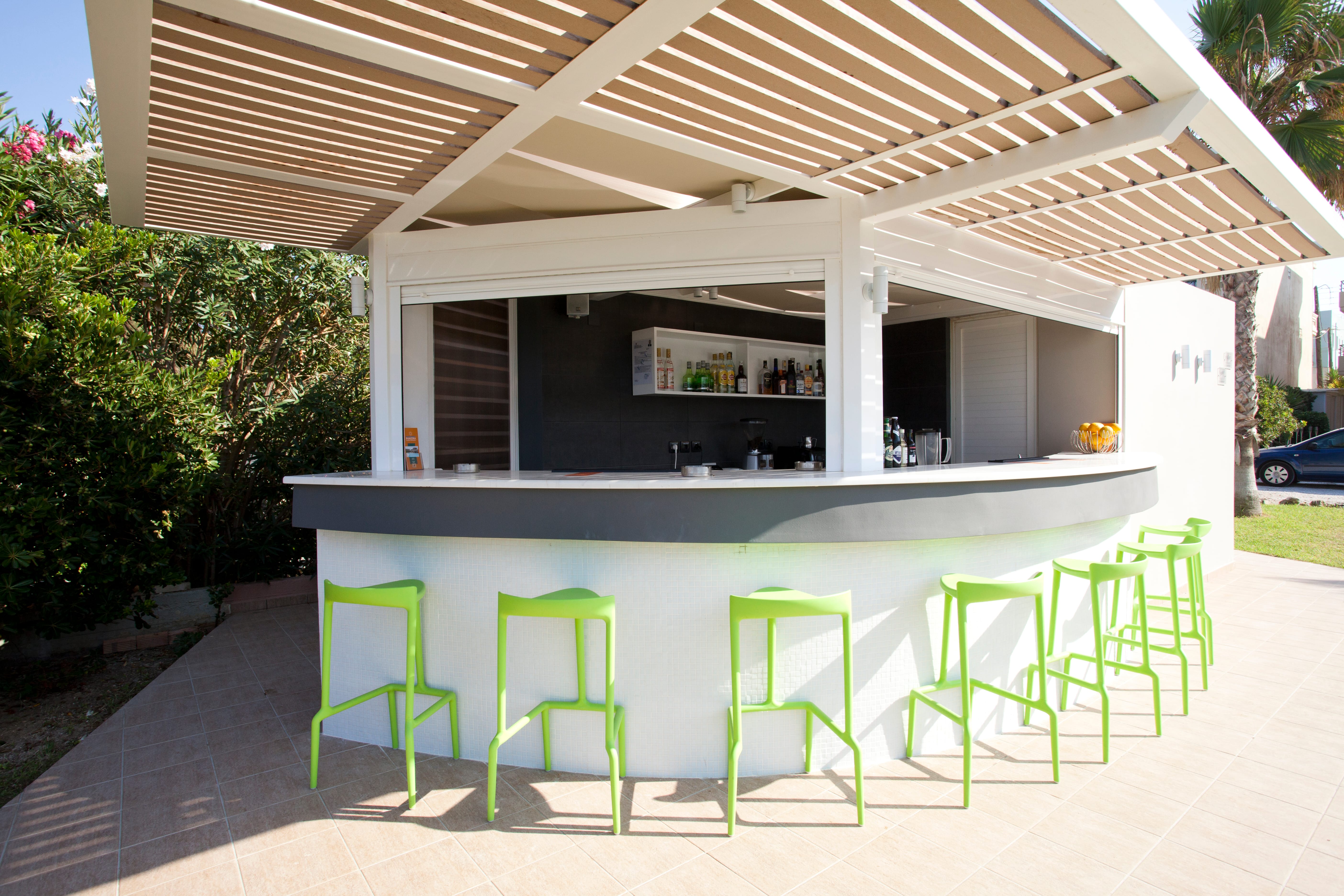 a house with a pool and chairs