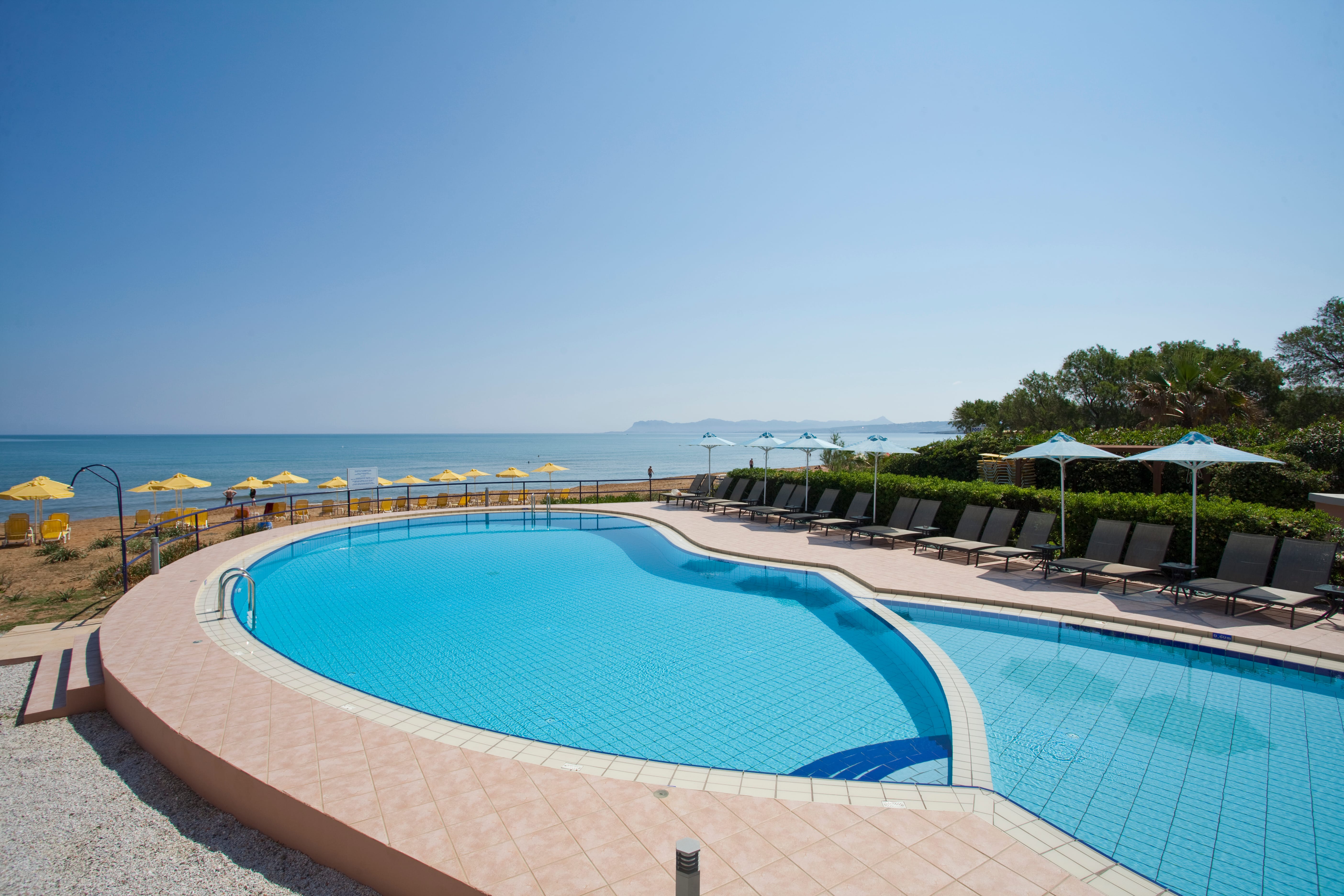 a pool next to a beach