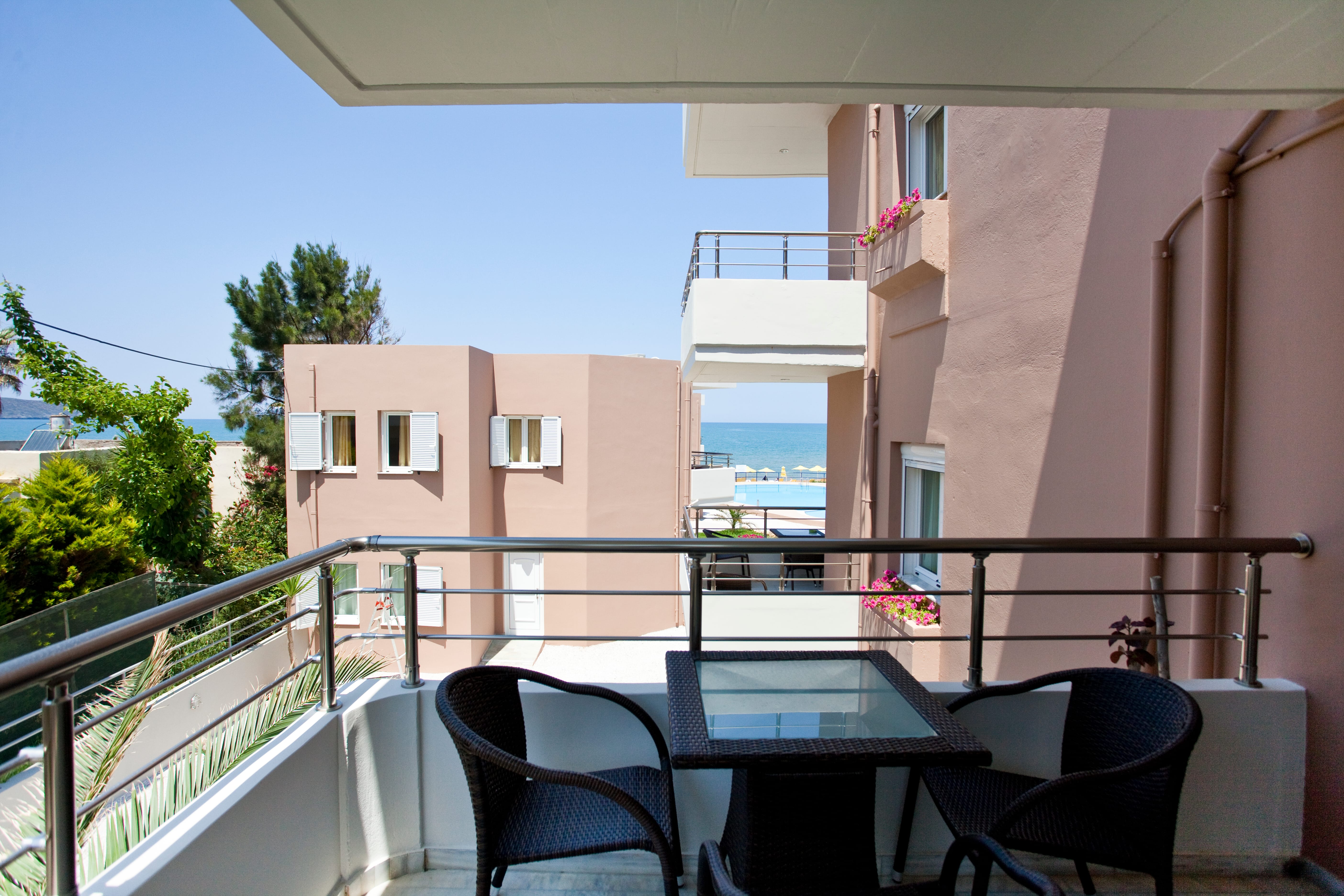 a table and chairs on a balcony