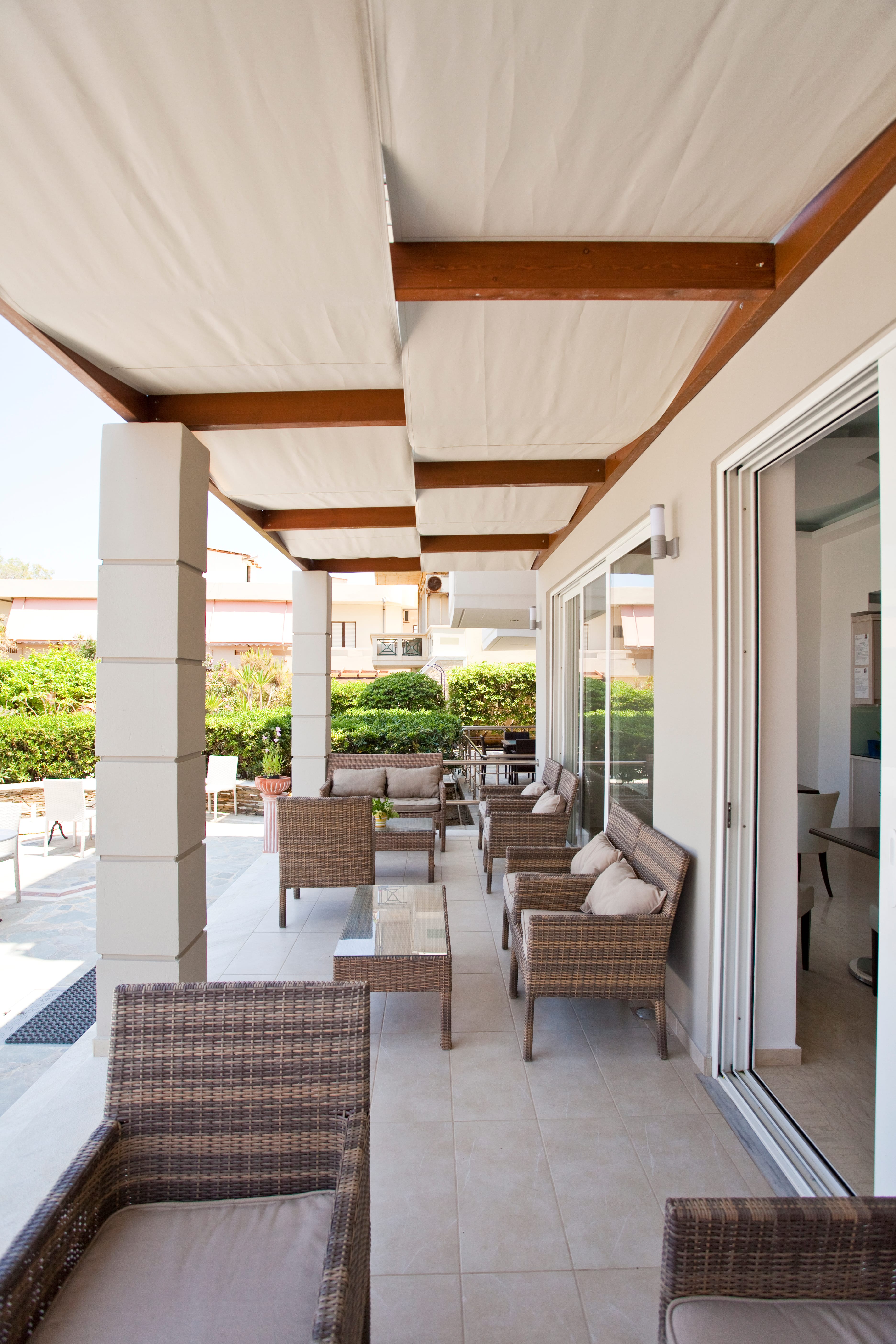 a patio with chairs and tables