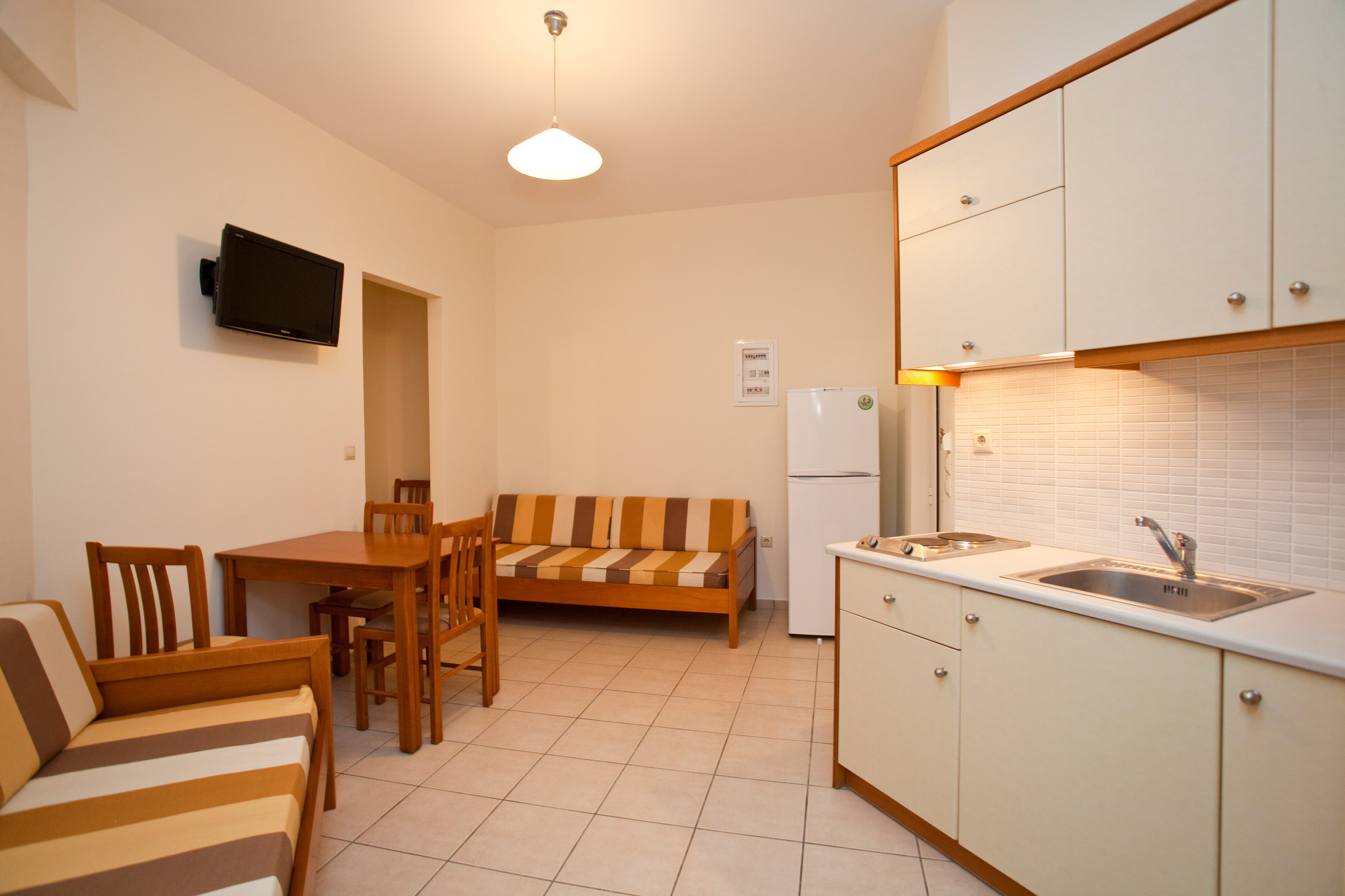 a kitchen with white cabinets