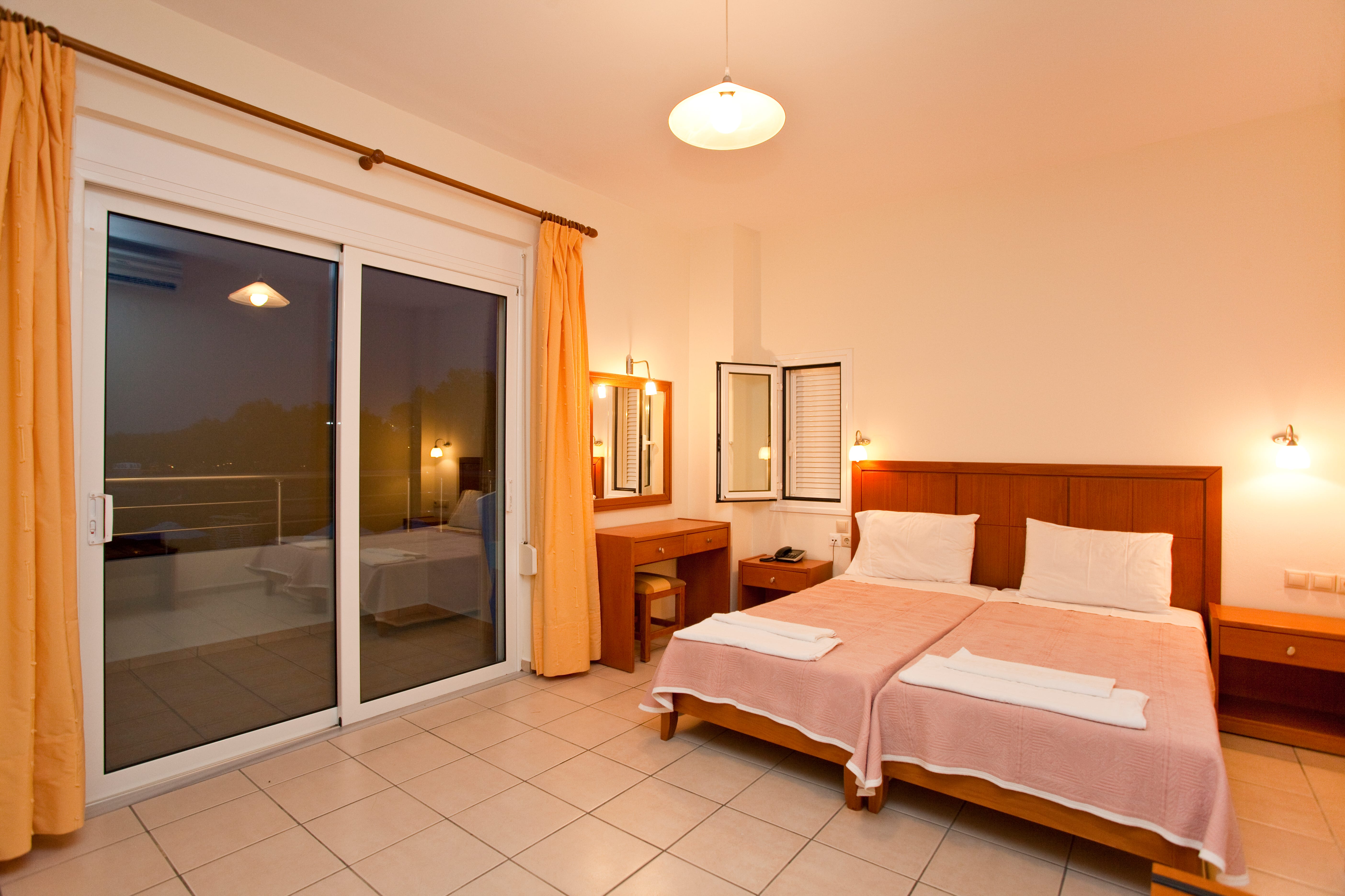 a bedroom with a large glass door