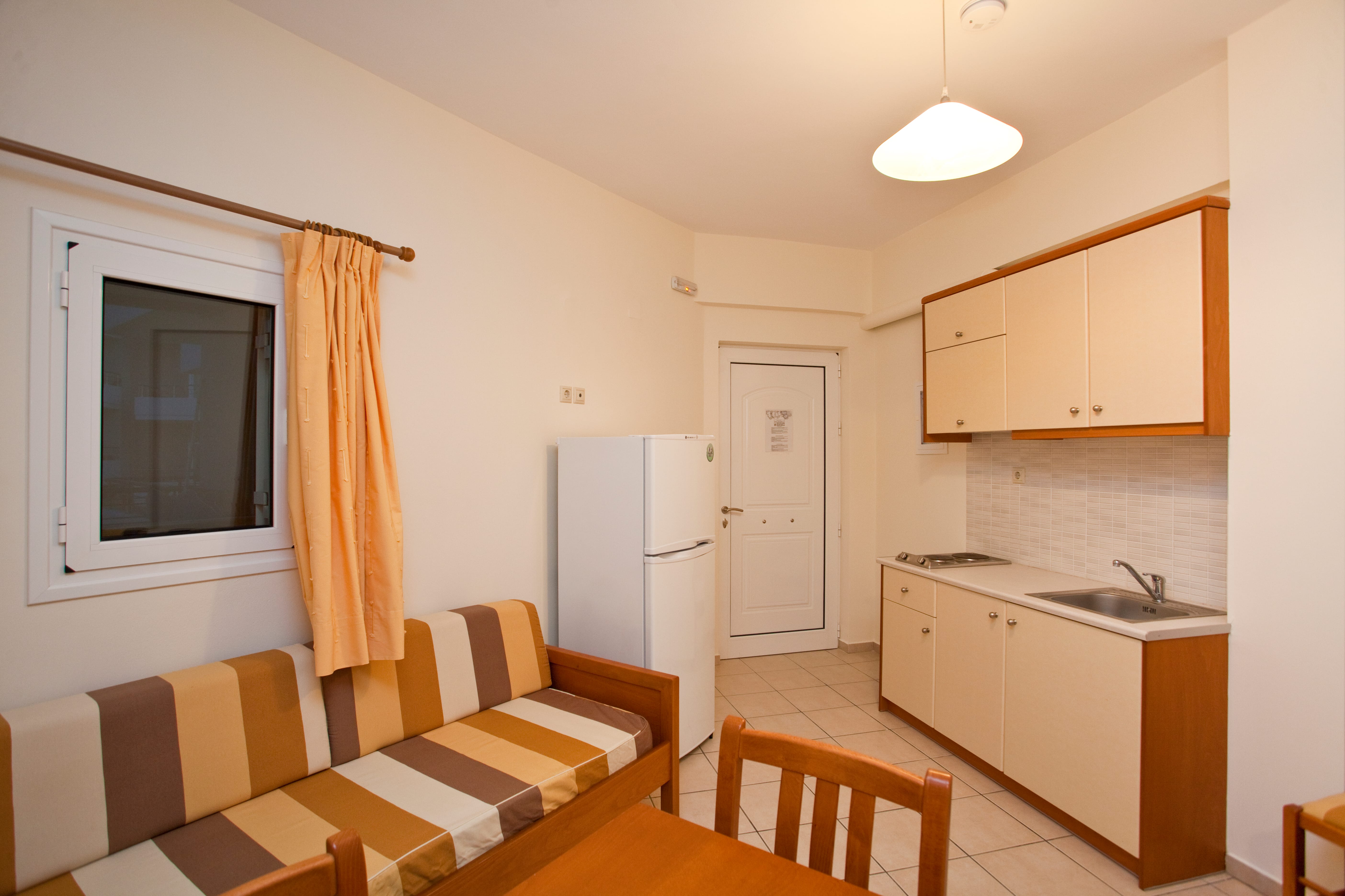 a kitchen with a table and chairs