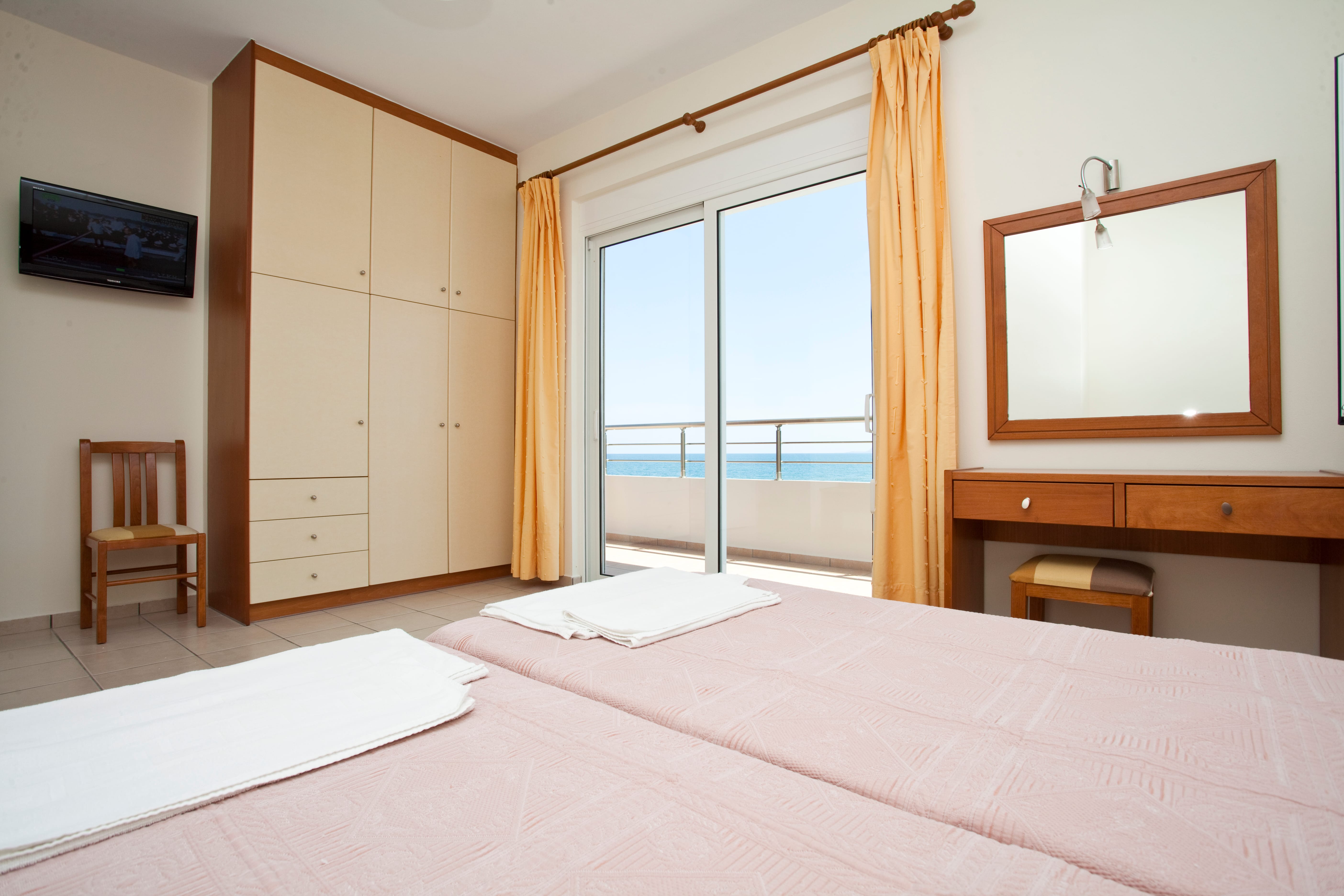 a bedroom with a large window