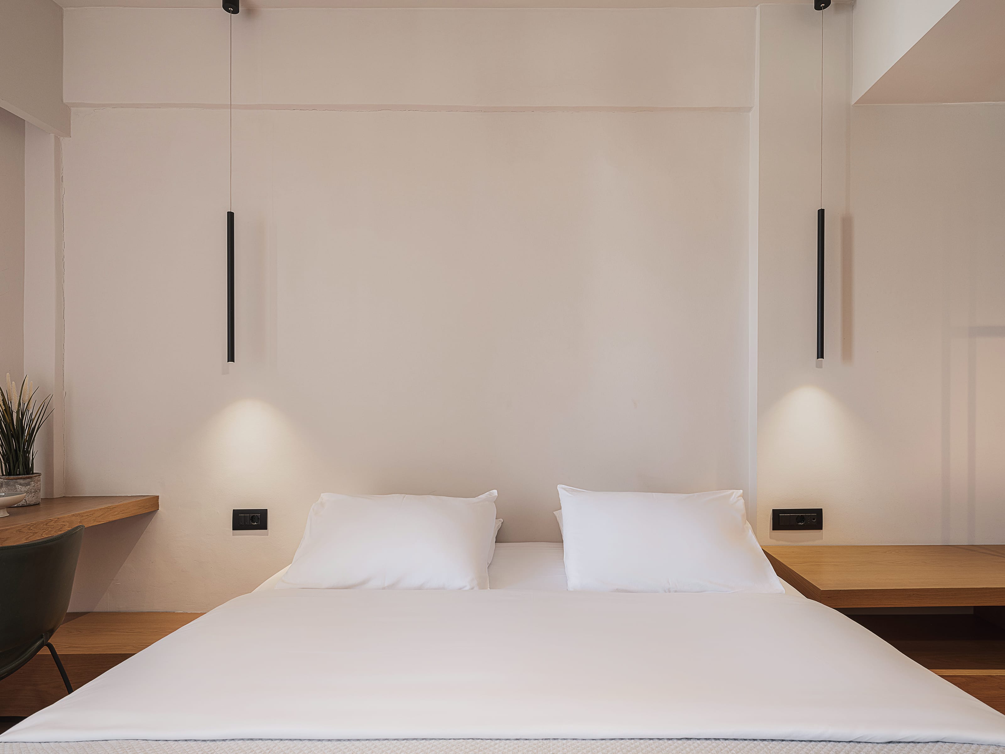 a bed with white sheets