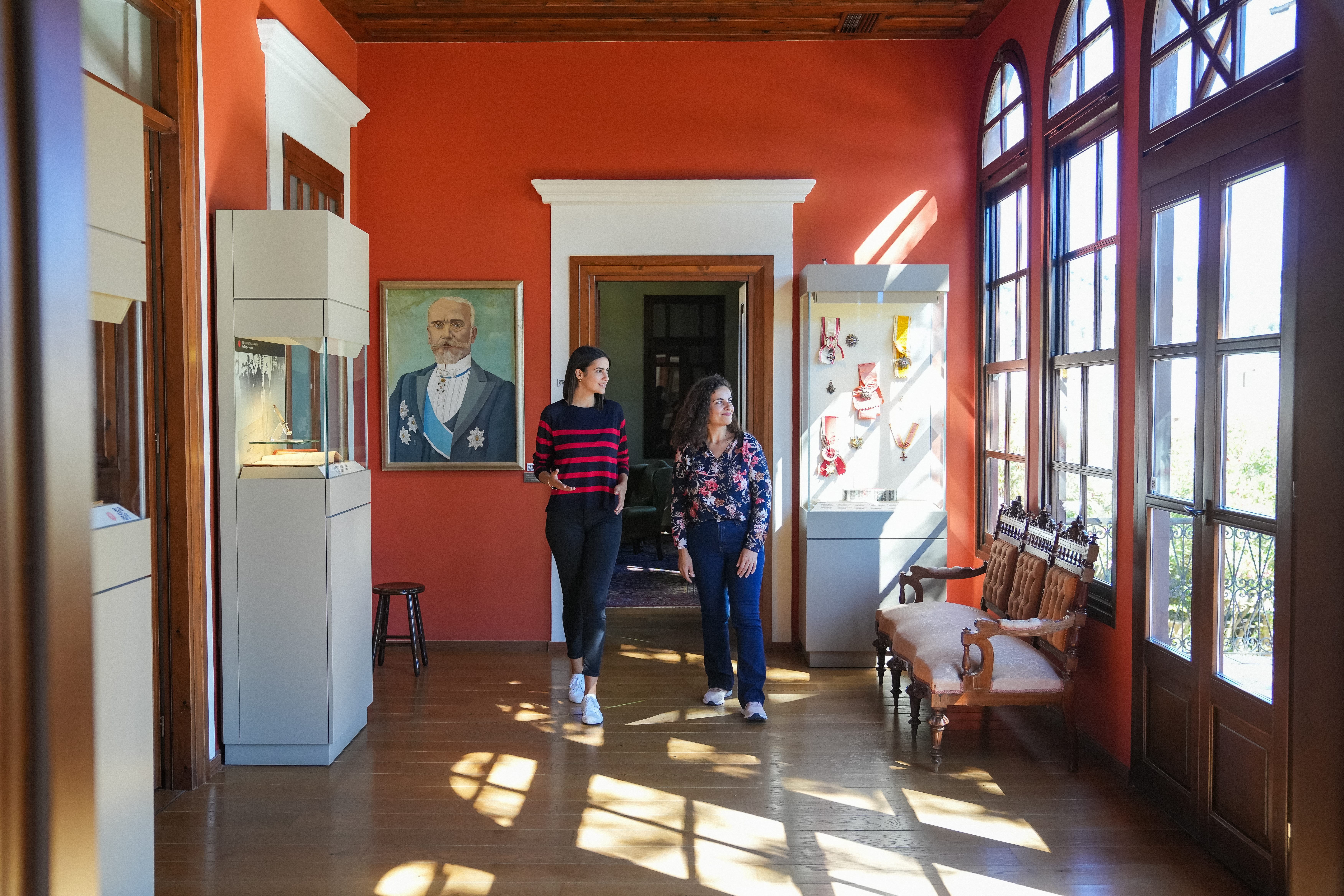 a couple of women standing in a hallway