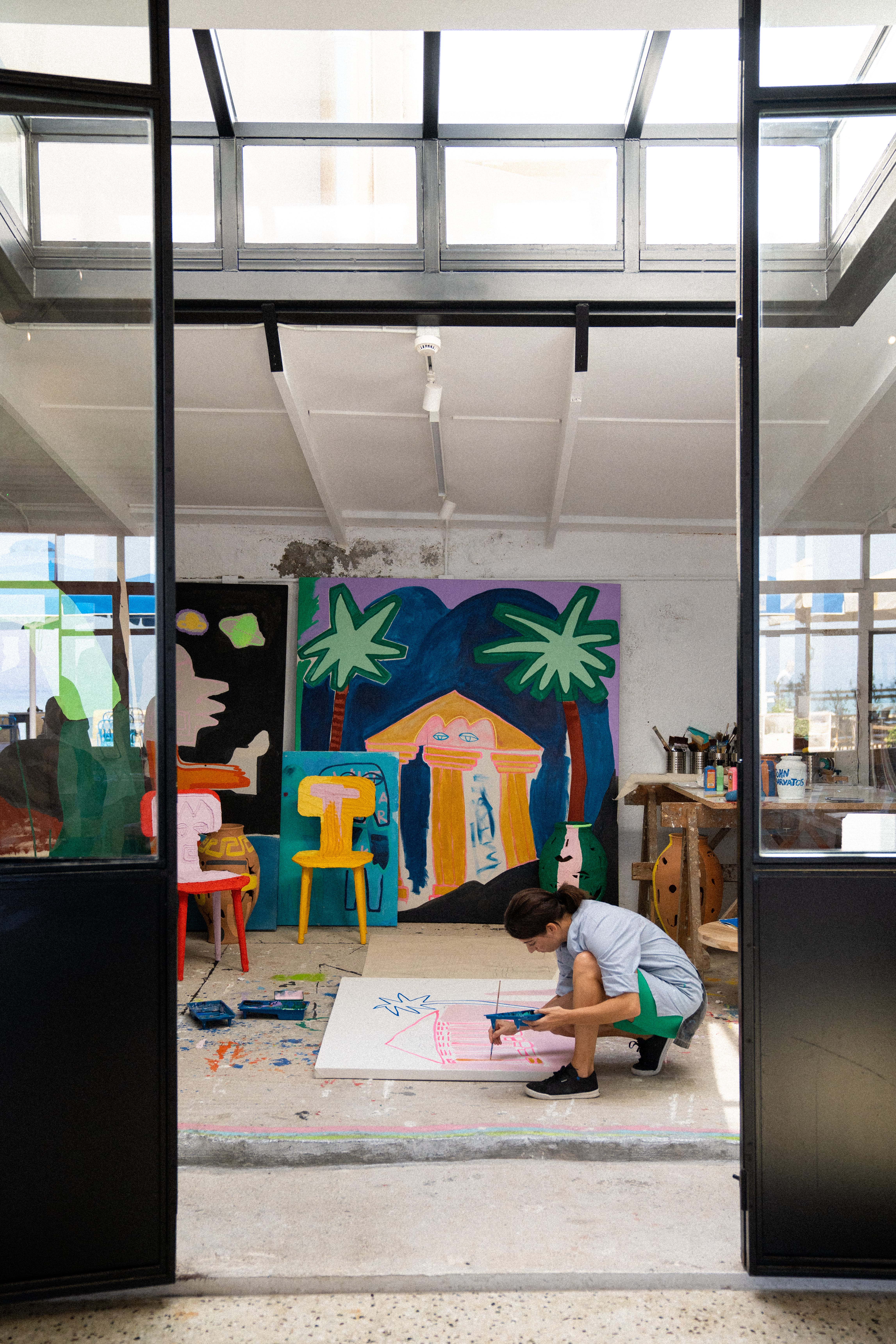 a person painting on a canvas