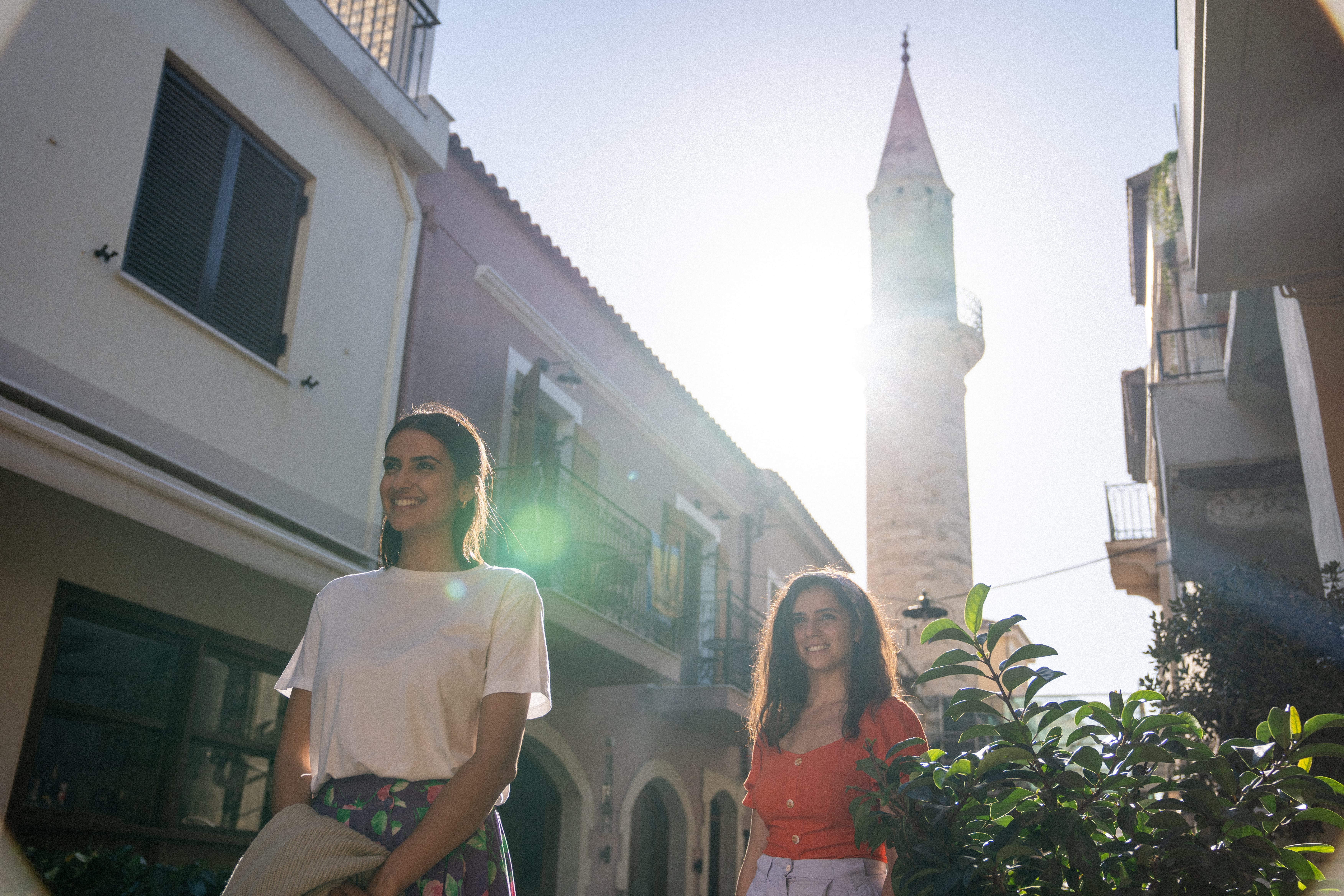 a man and woman standing outside a building