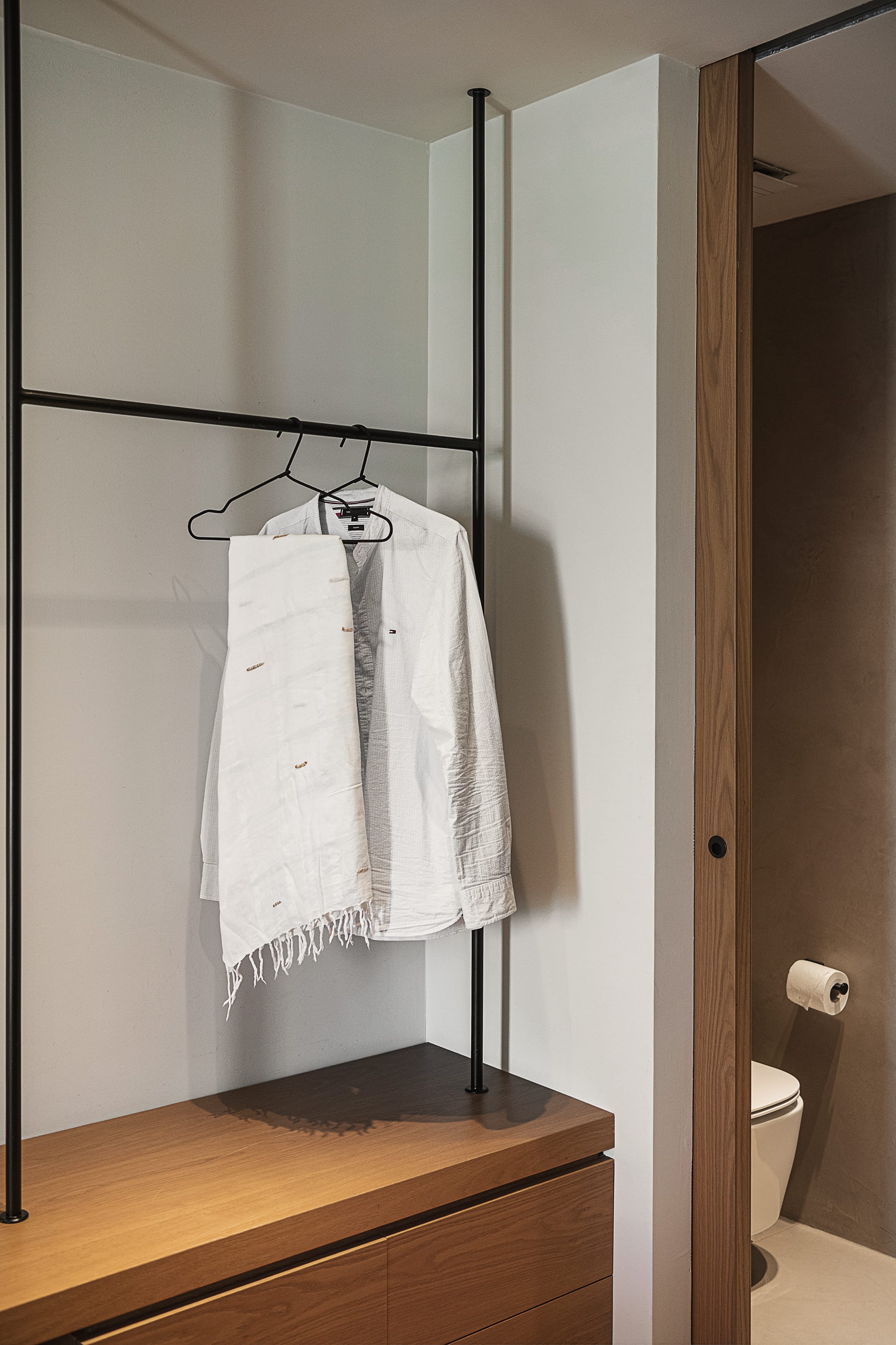a bathroom with a white towel on the wall