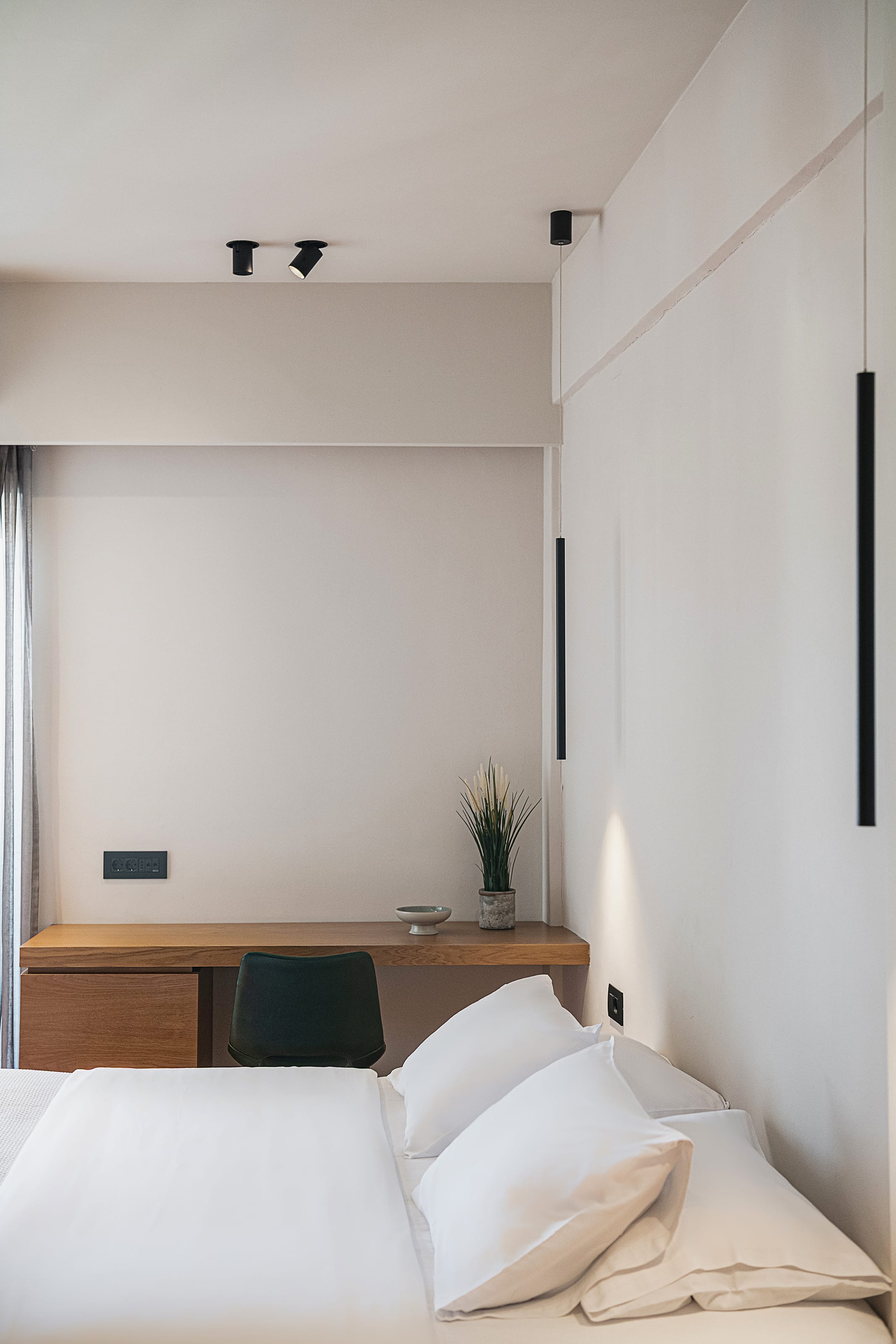 a room with a bed and a desk