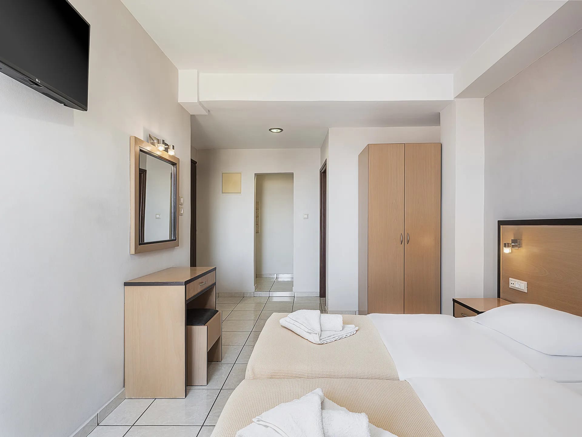a room with a bed and a desk