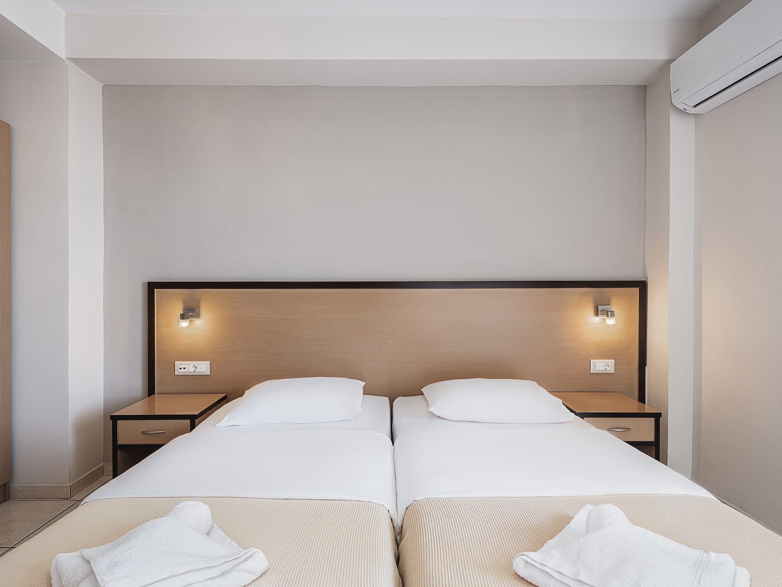 a hotel room with two beds