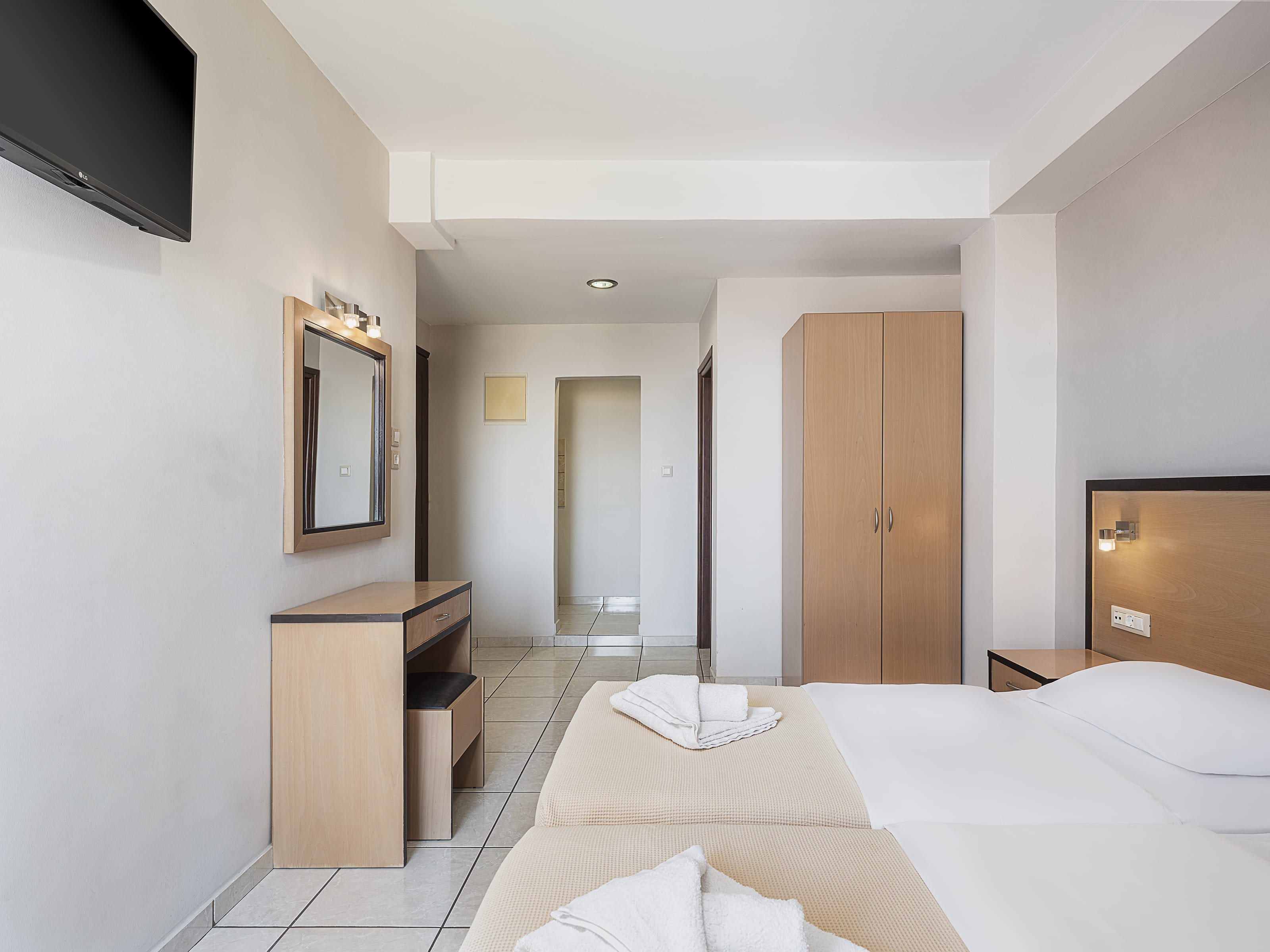 a room with a bed and a desk