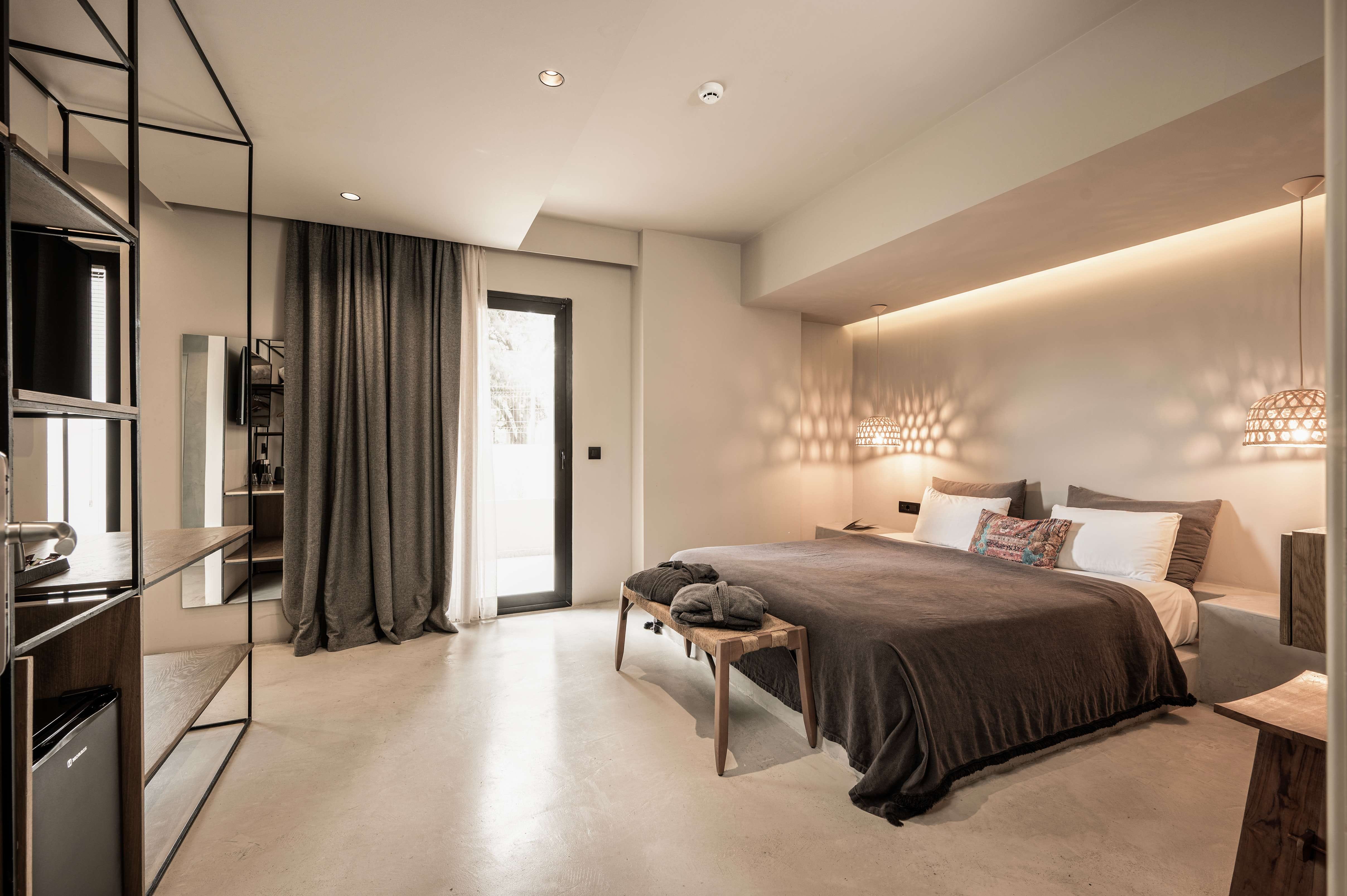 a bedroom with a bed and a tv