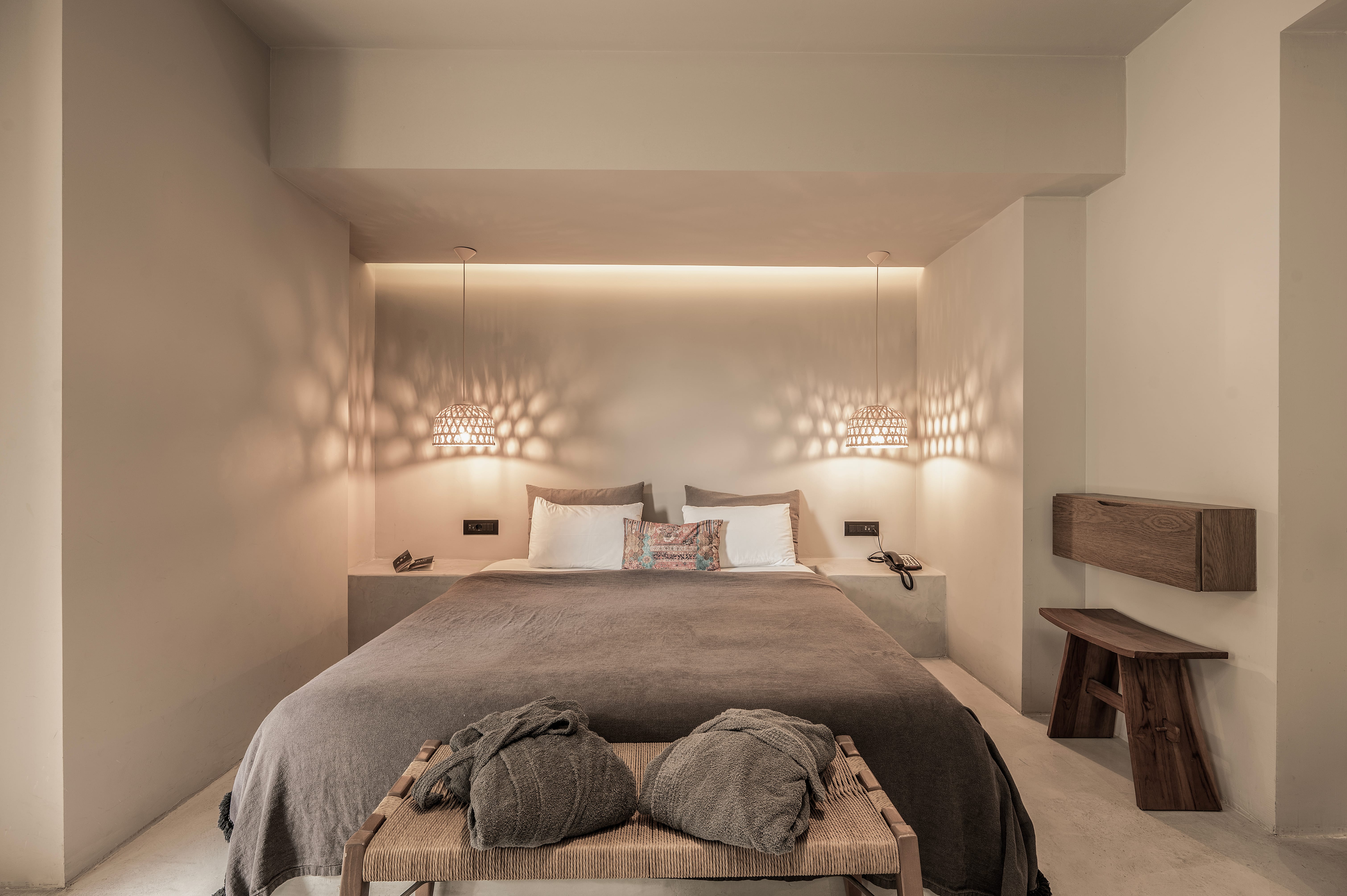 a bedroom with a bed and a table