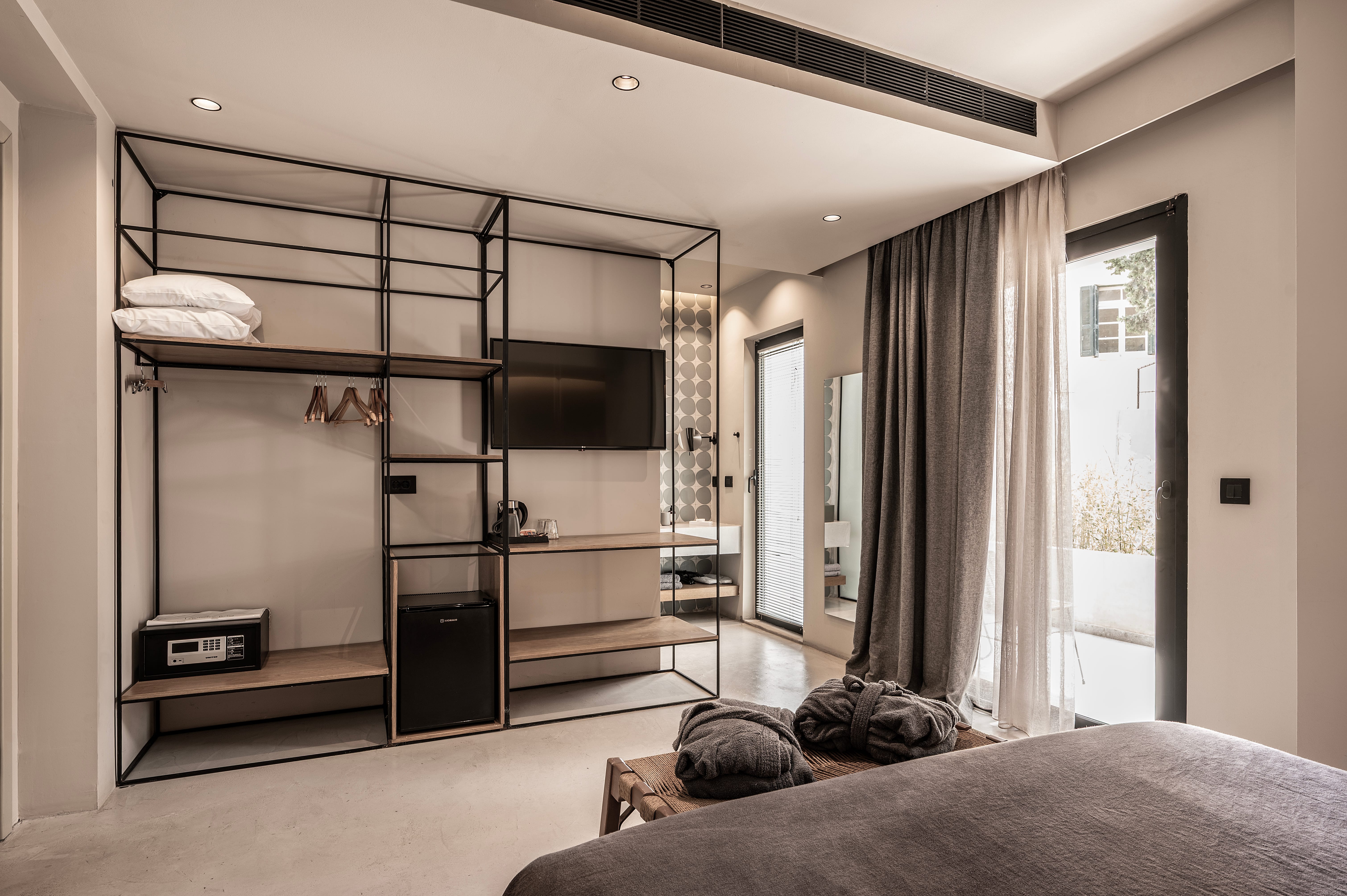 a bedroom with a bed and a closet