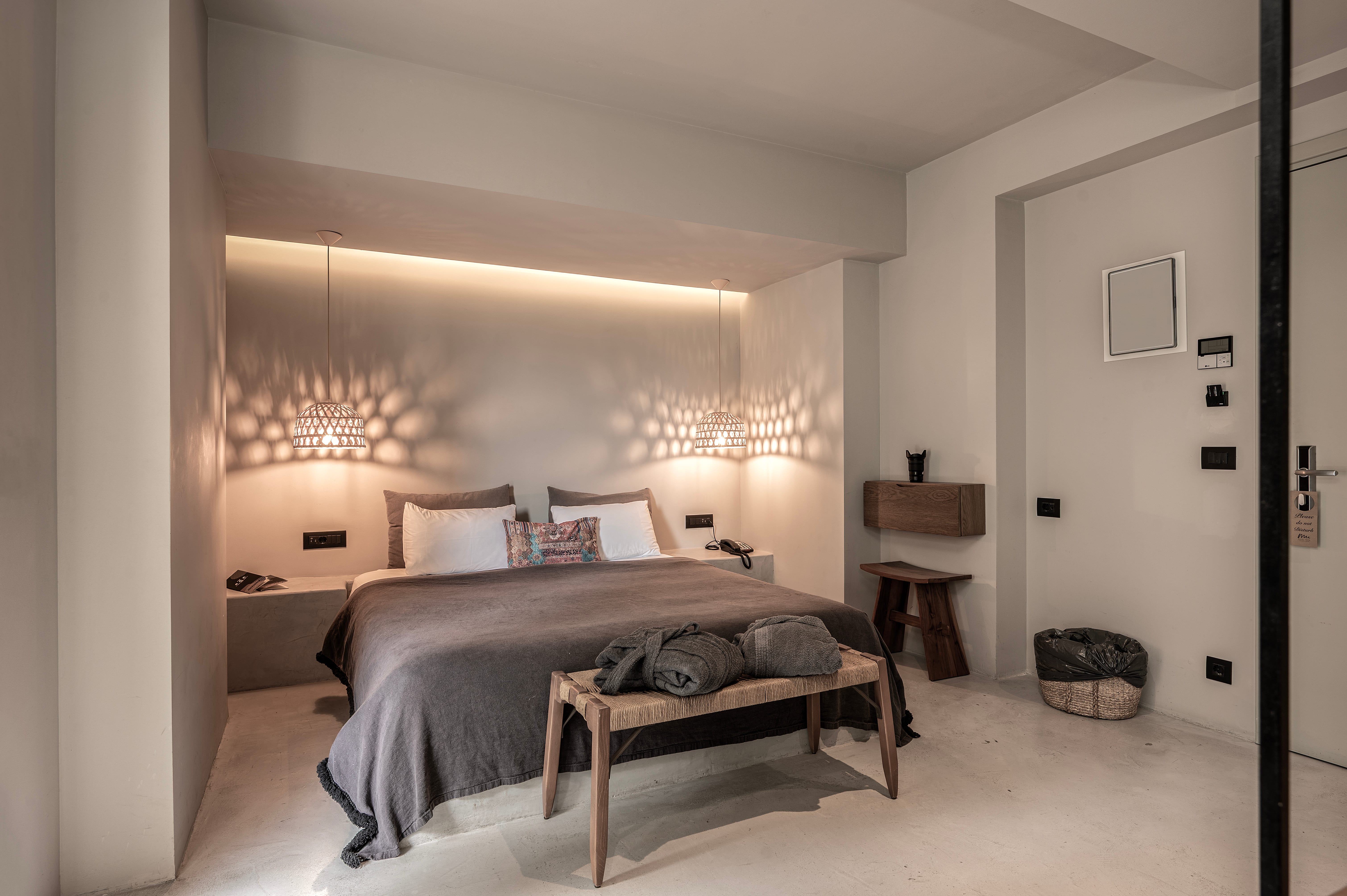 a bedroom with a bed and a table