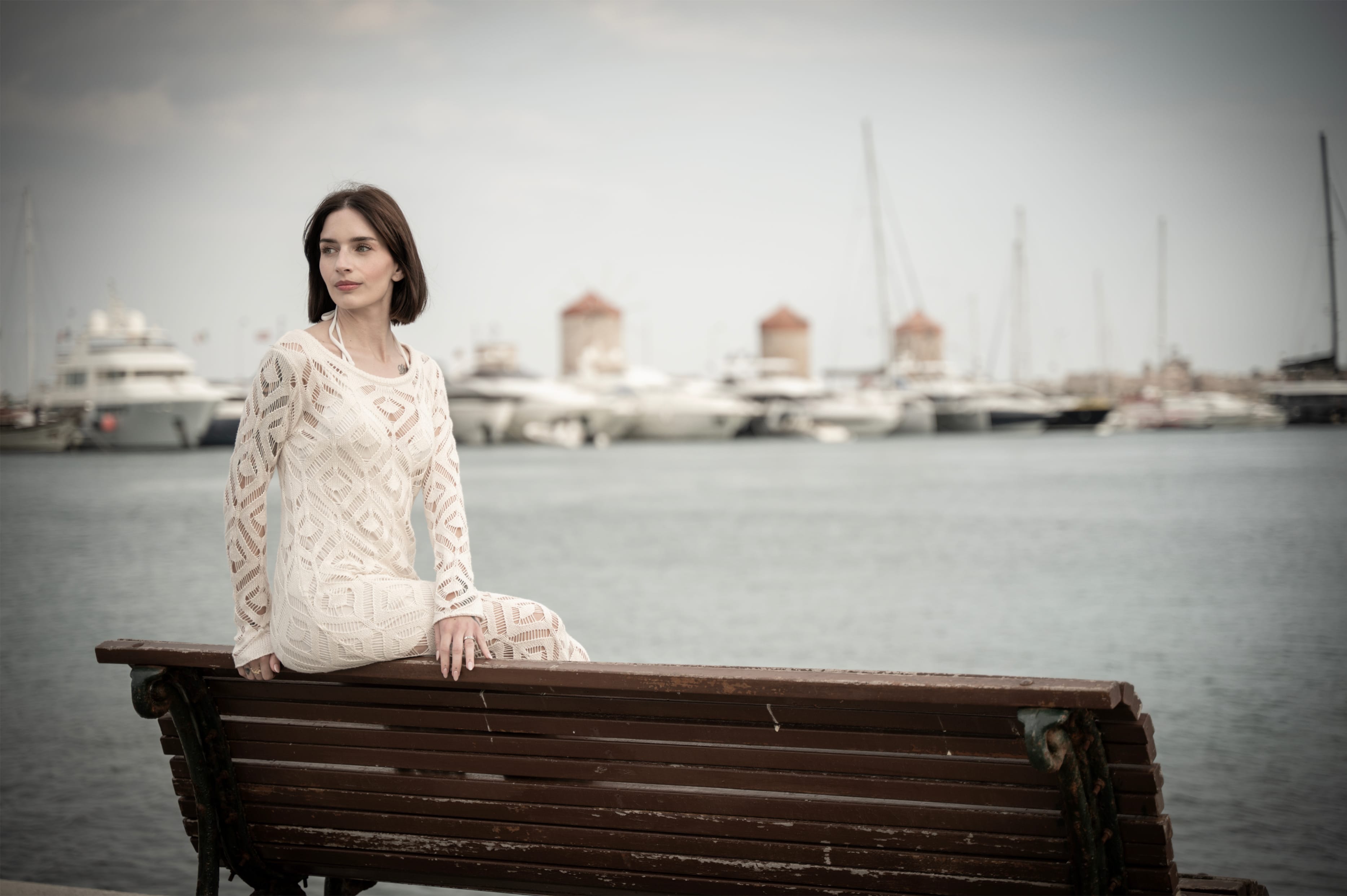 a woman sitting on a bench