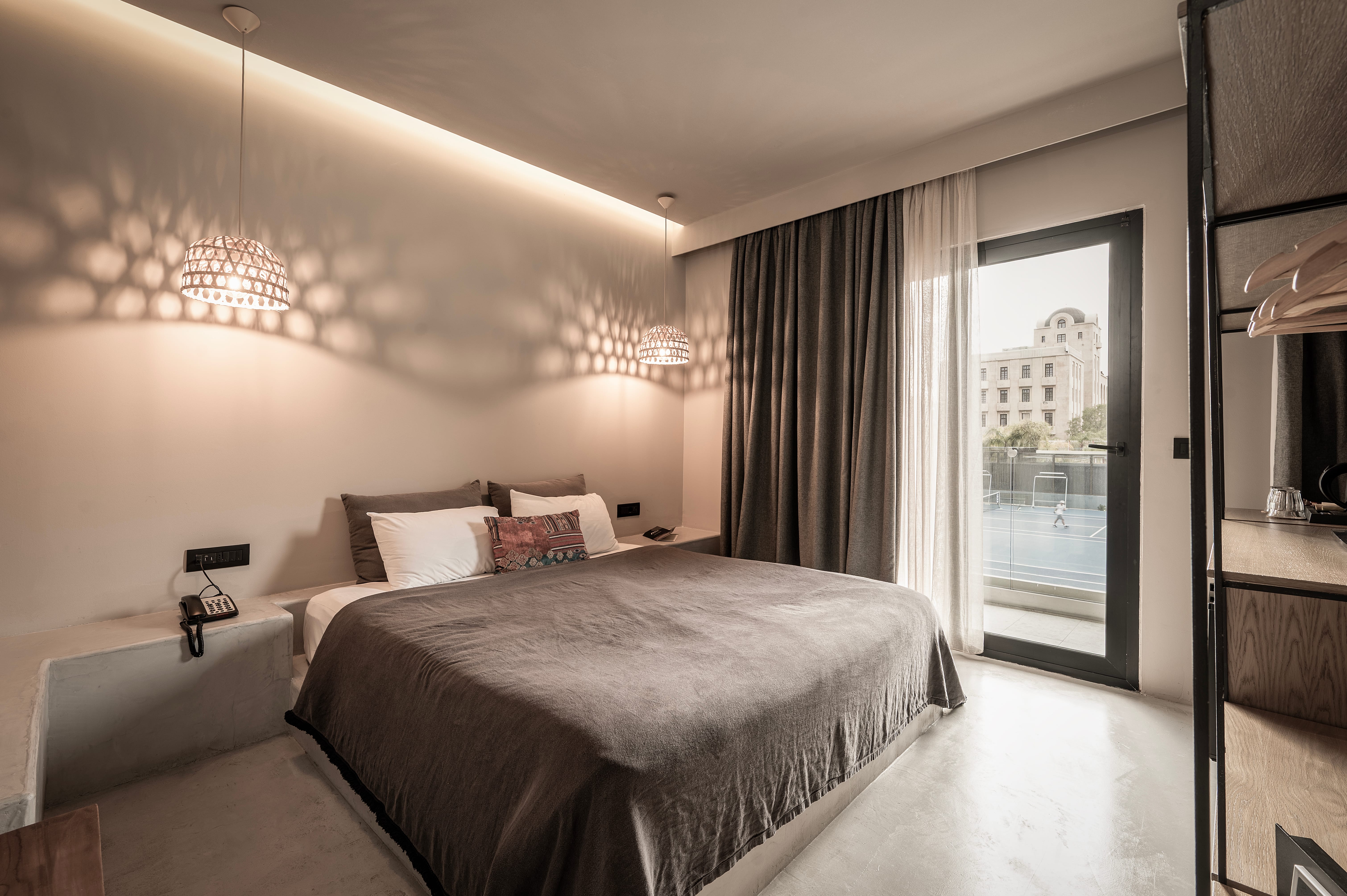 a bedroom with a large glass door