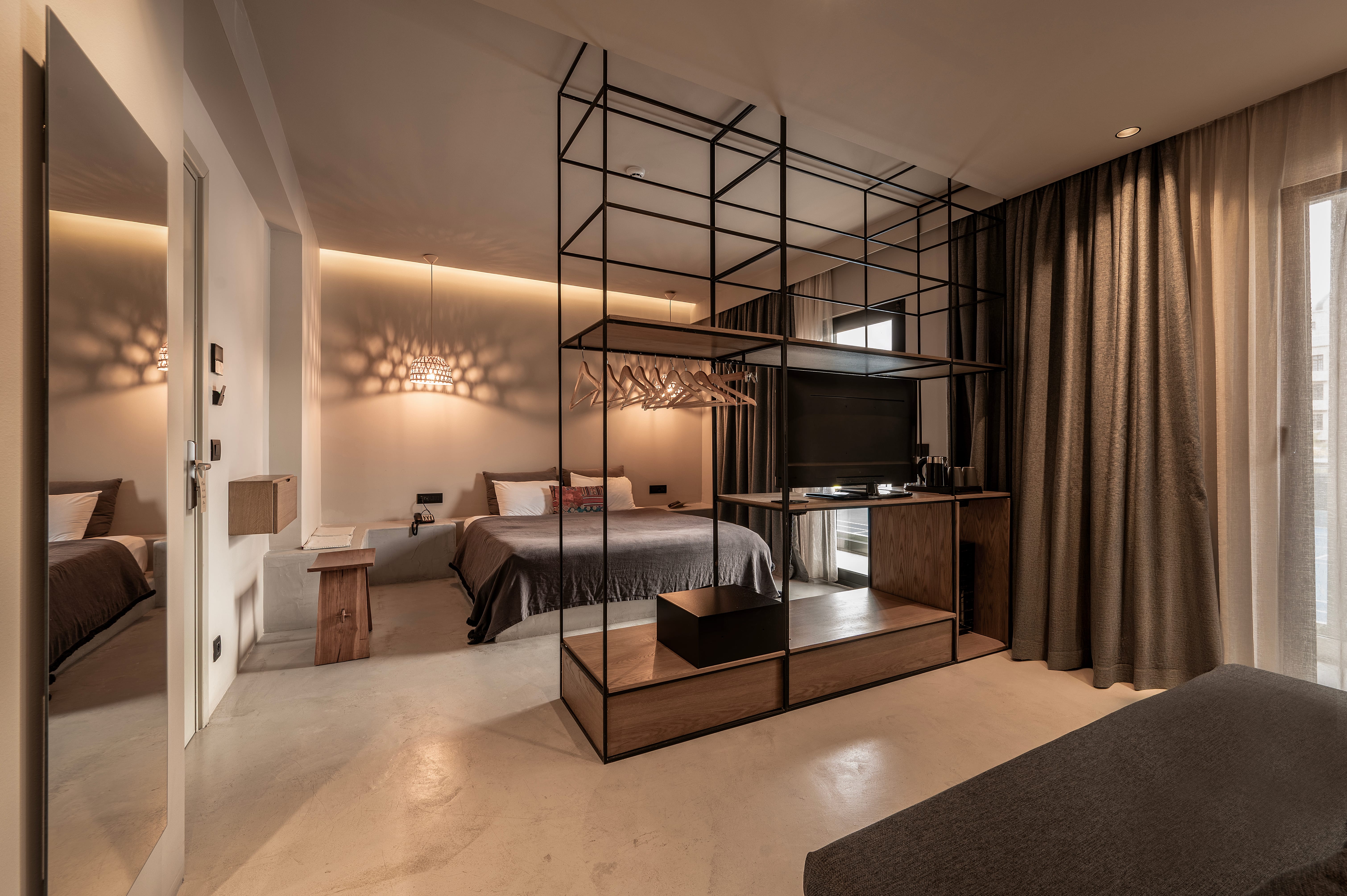 a room with a bed and a tv