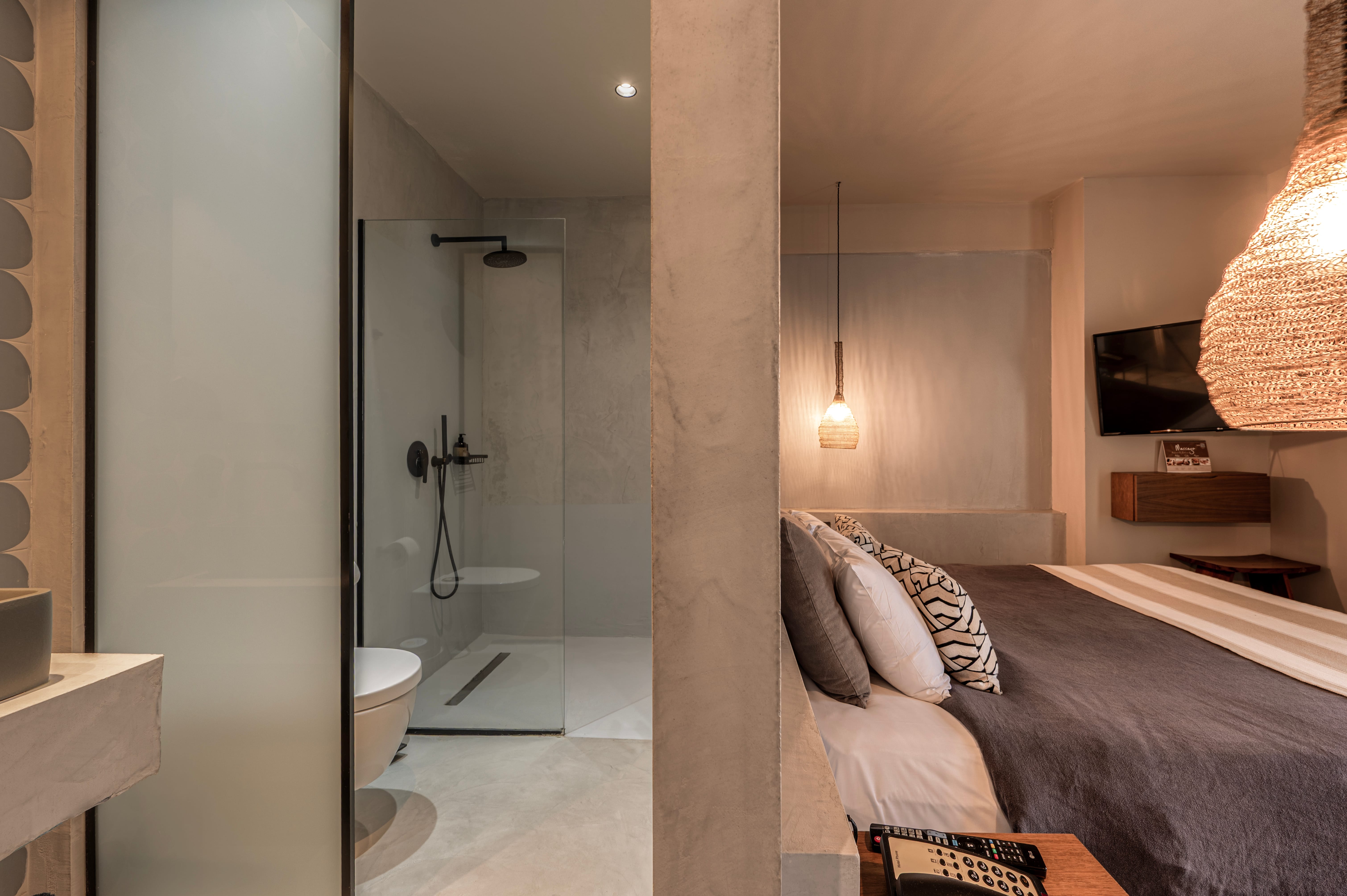 a hotel room with a bed and a shower