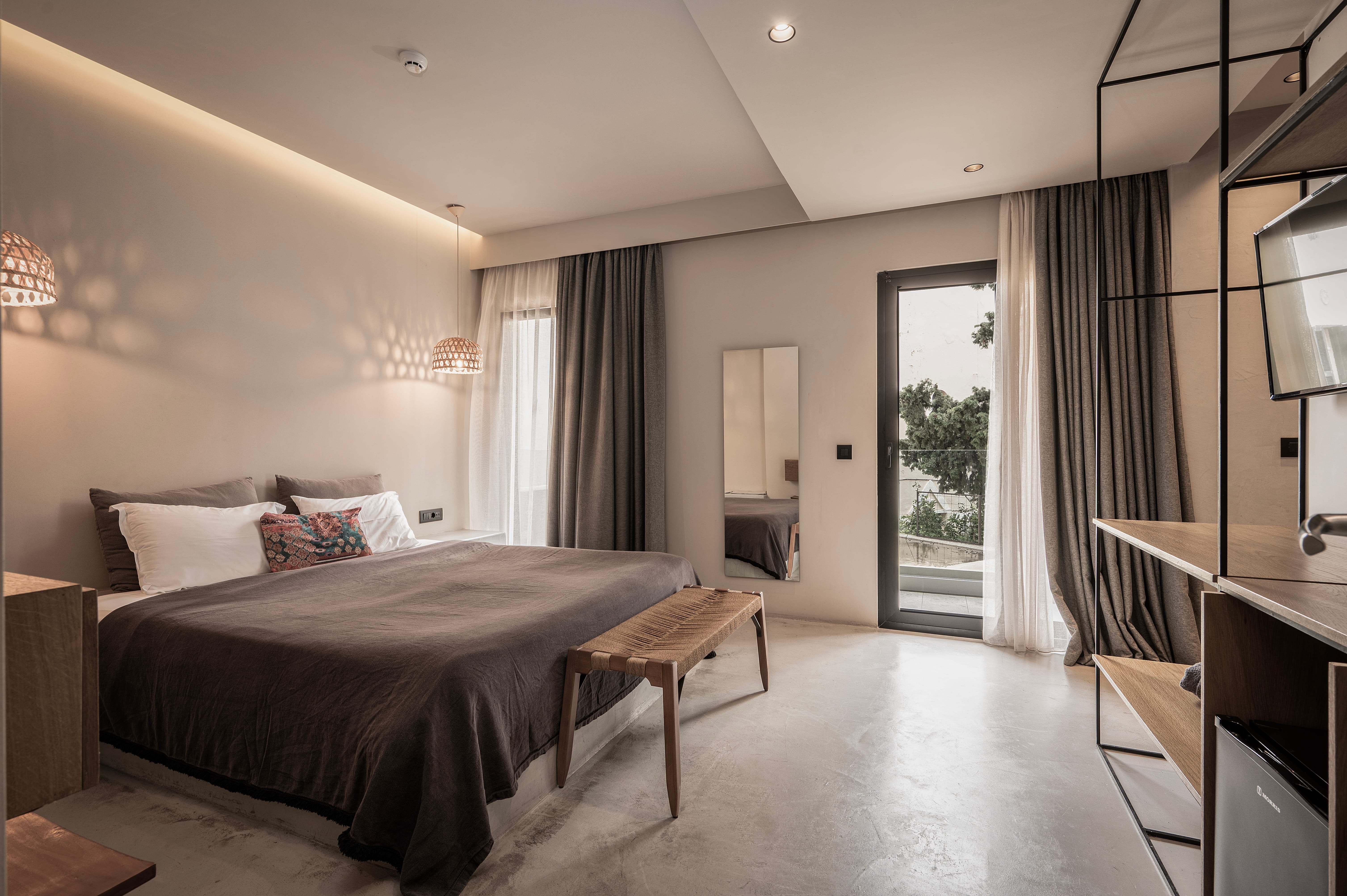 a bedroom with a bed and desk