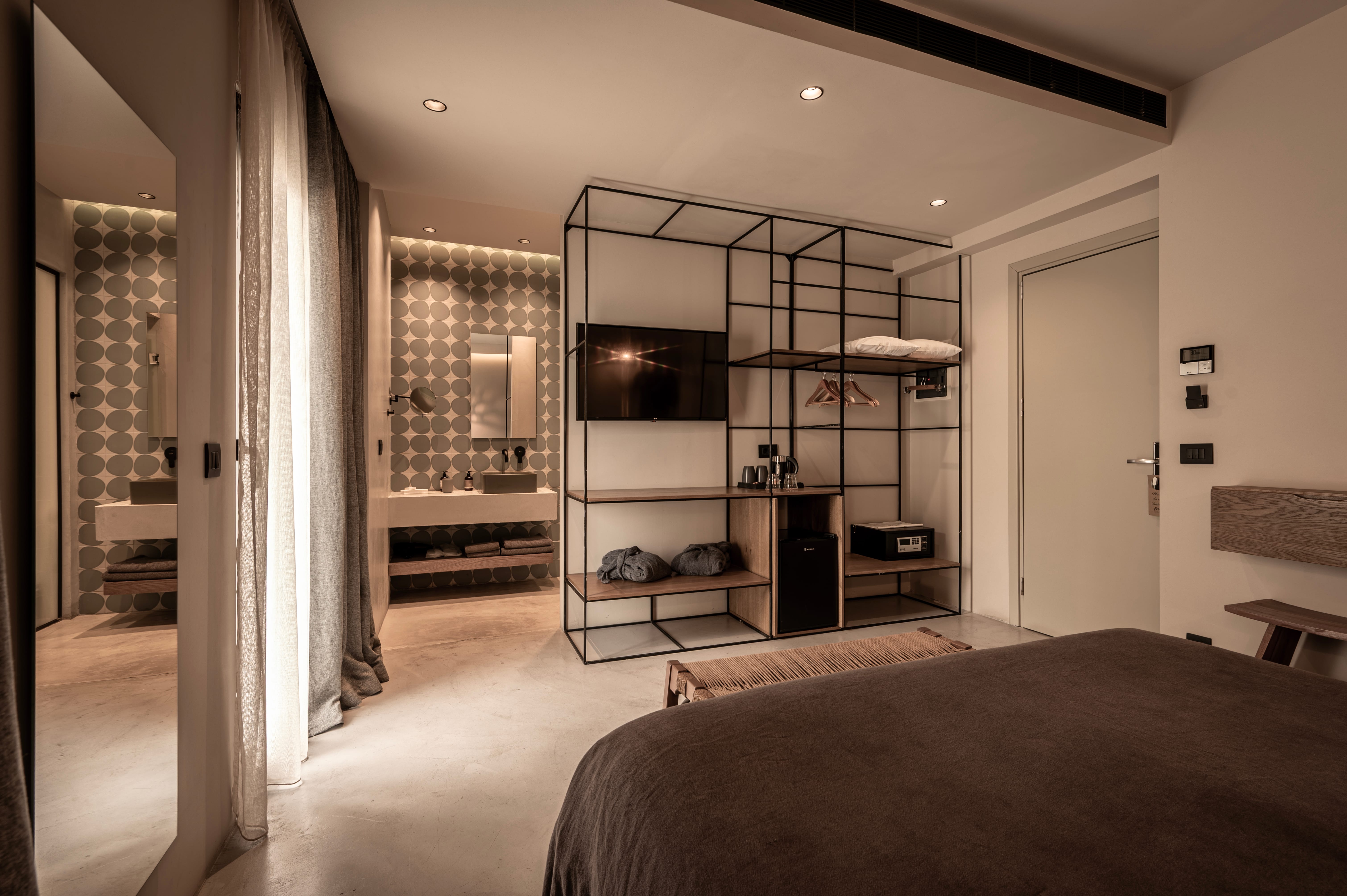 a bedroom with a large mirror