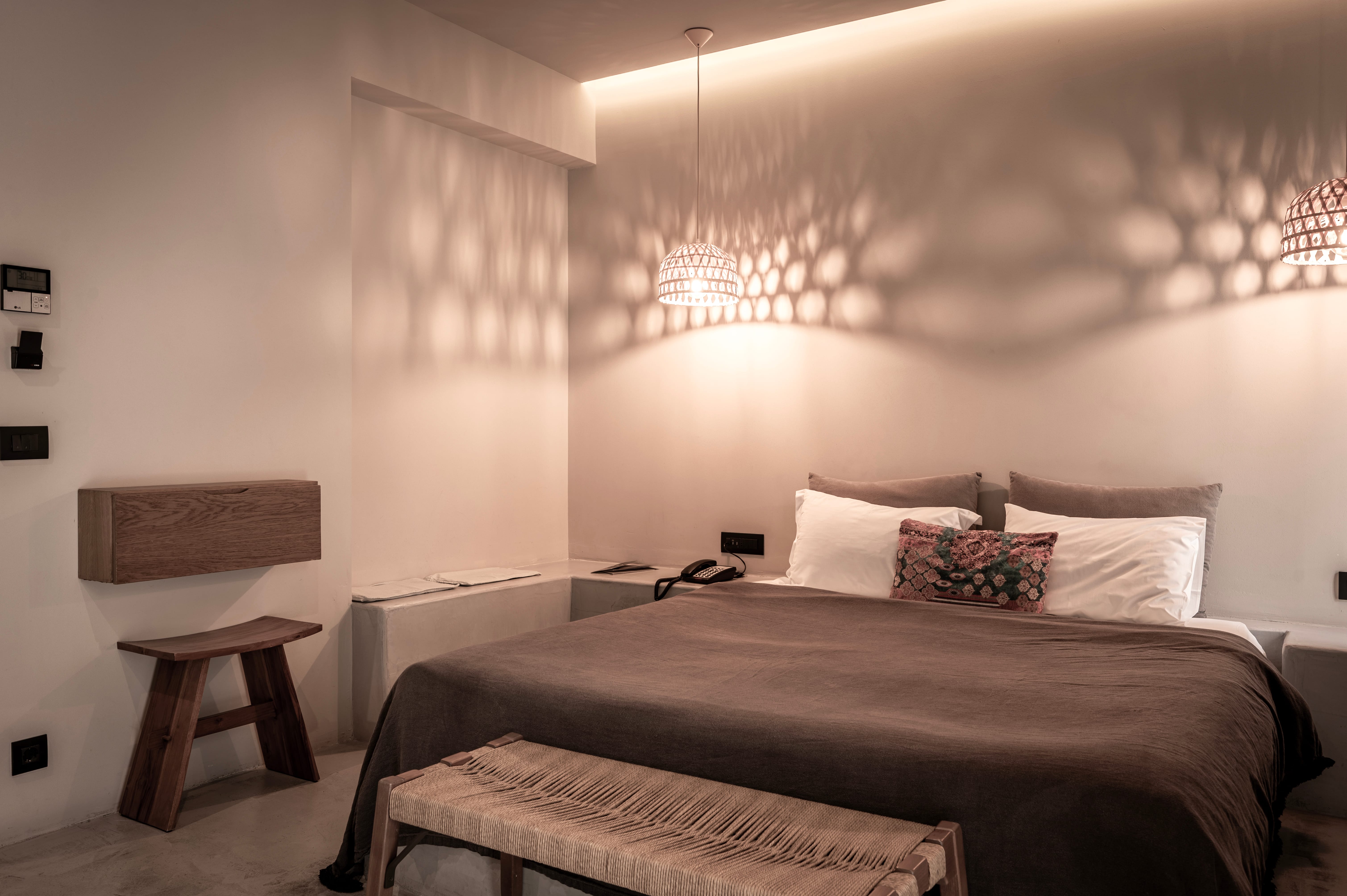 a bed with a table and chairs