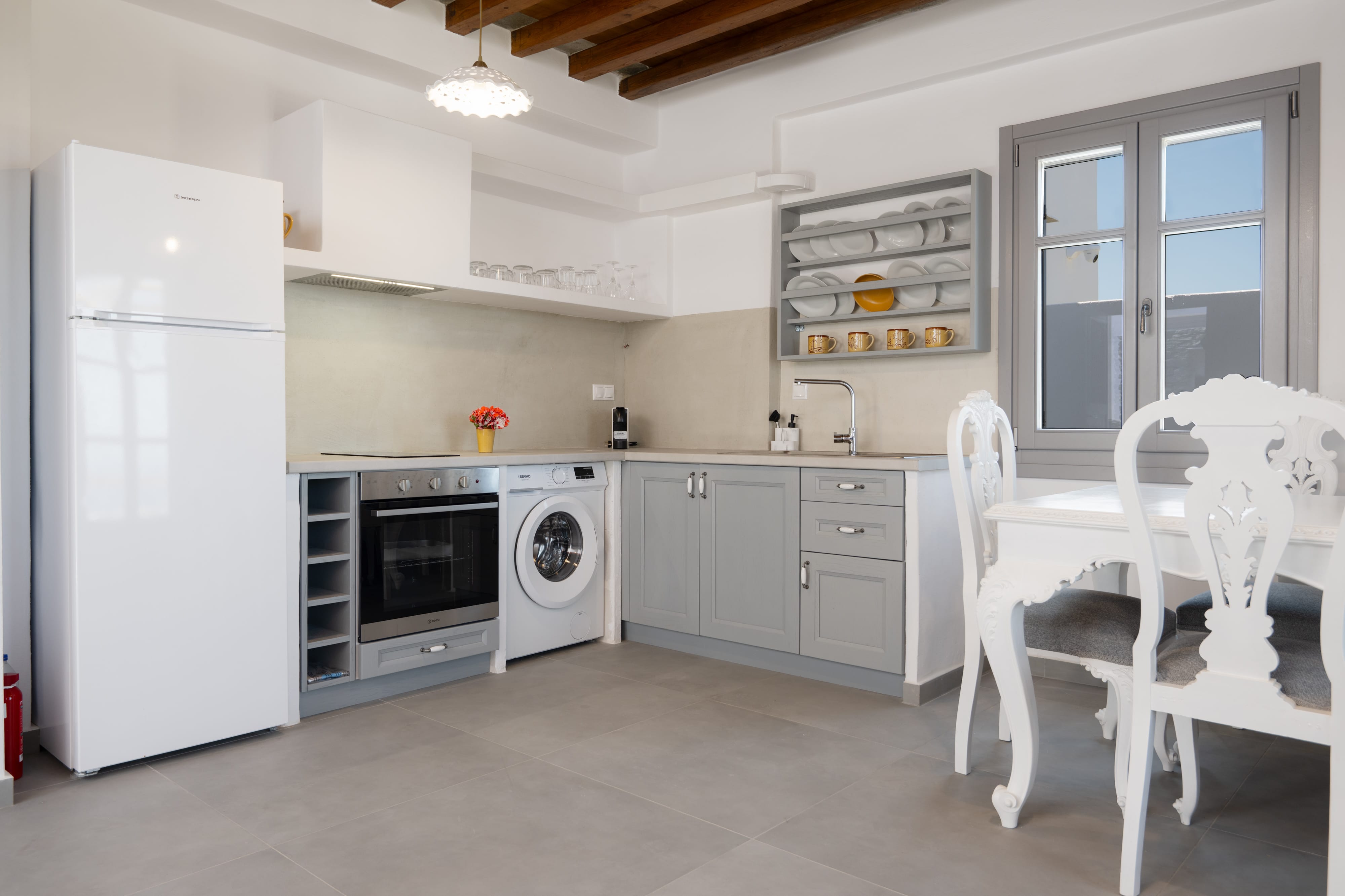 a kitchen with a table and appliances