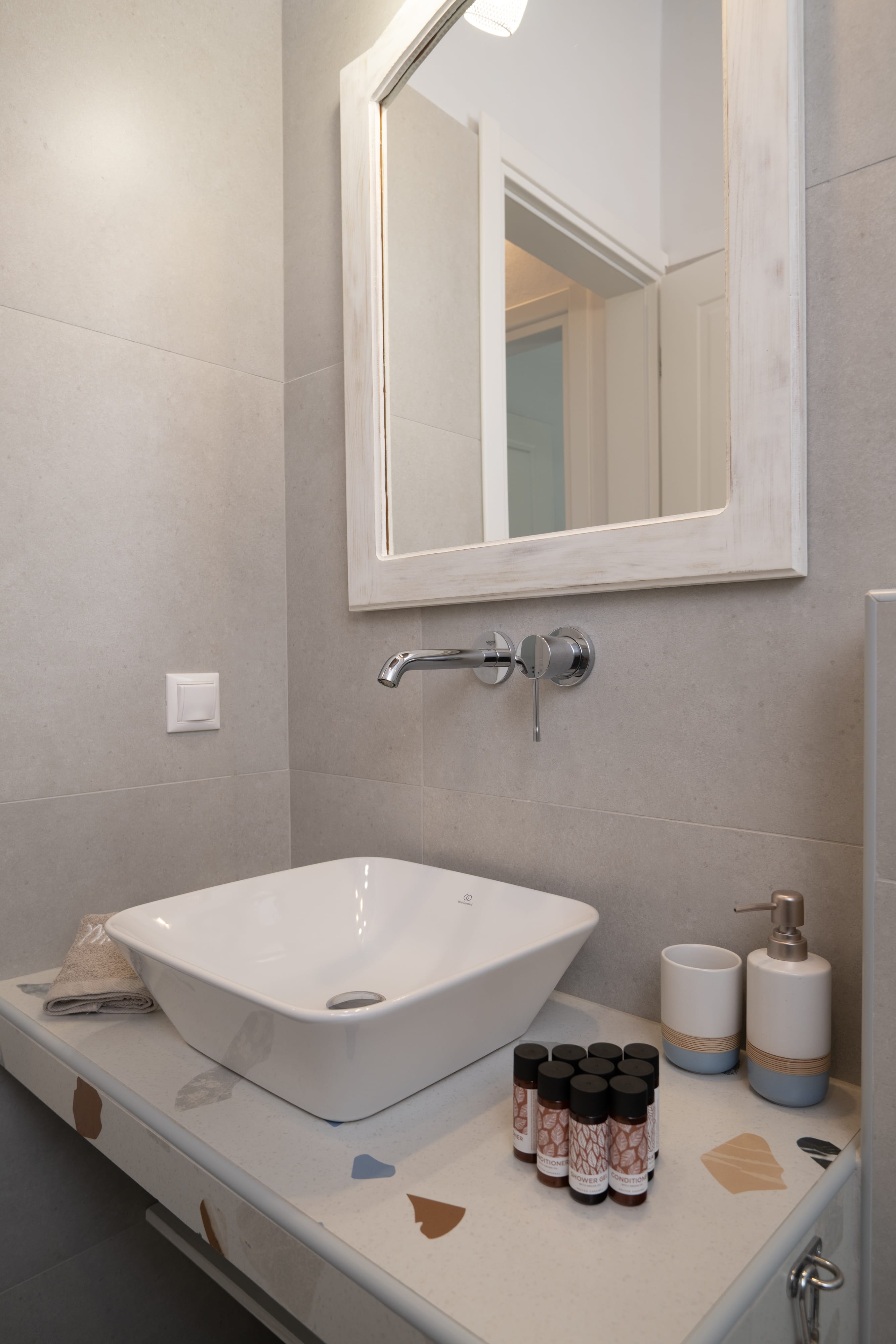 a bathroom with a mirror and a sink