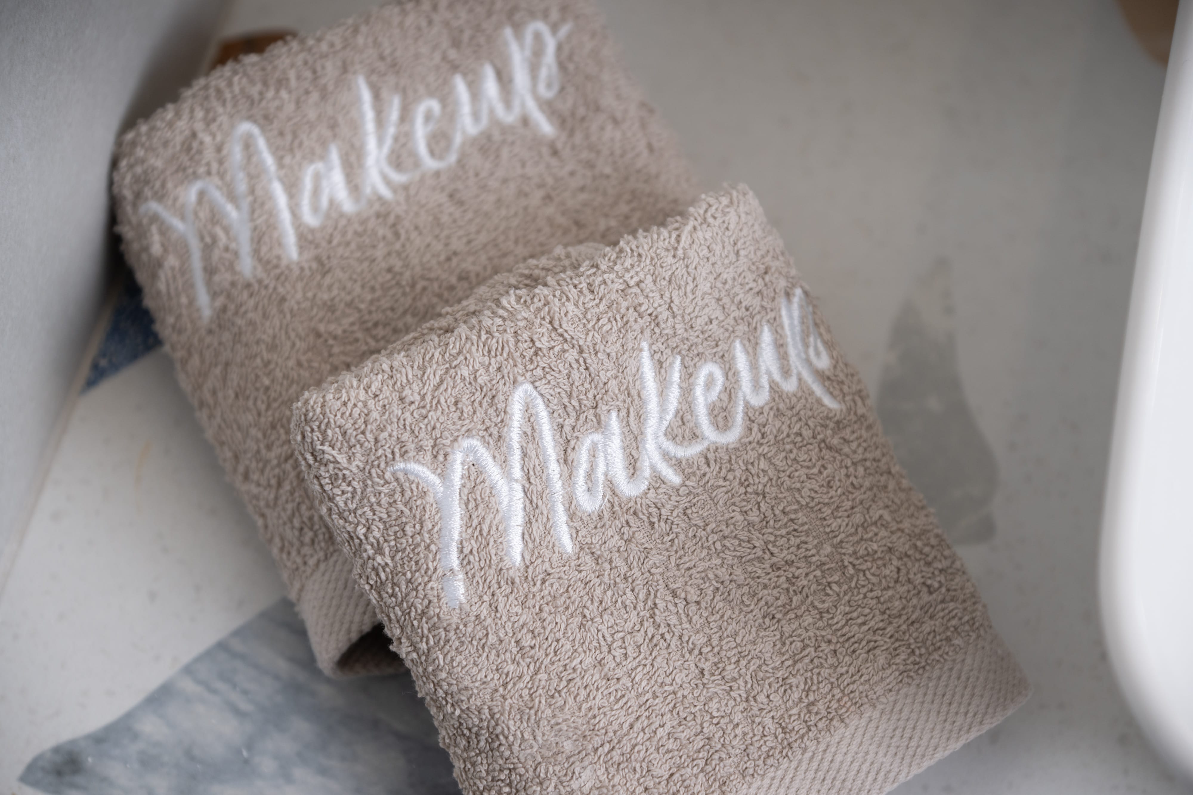 a pair of towels with writing on them