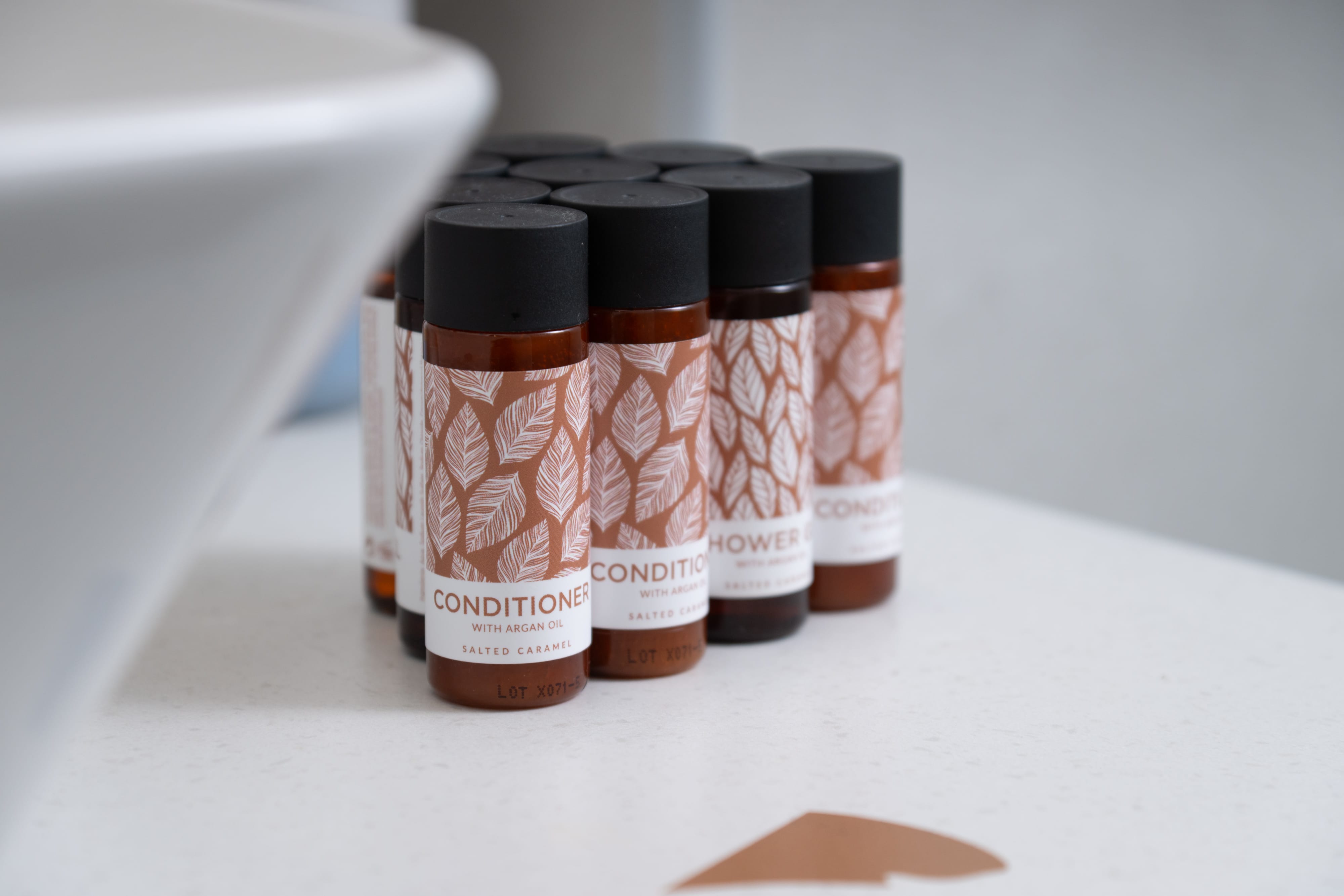 a group of small bottles with brown labels