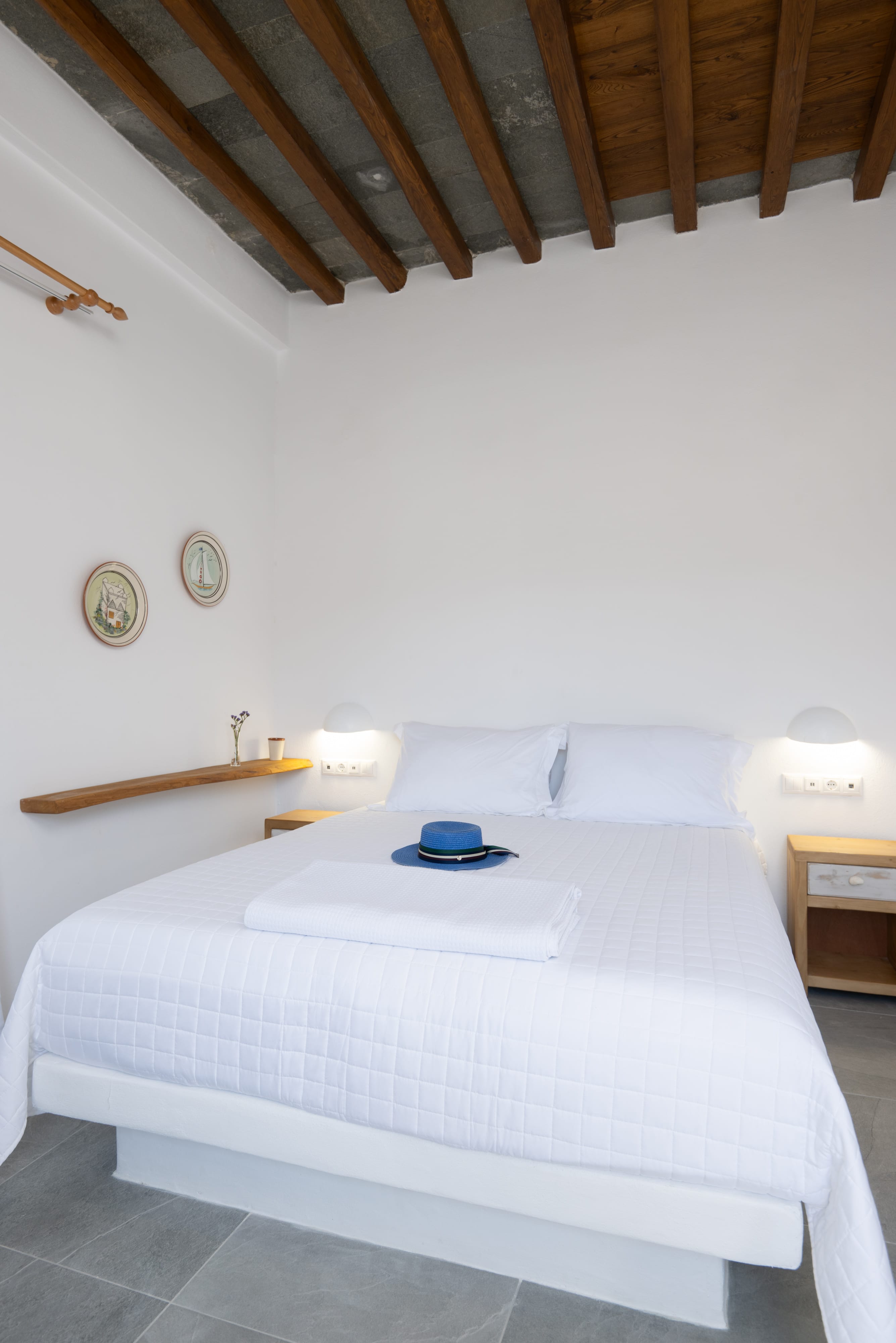 a bed with a hat on it