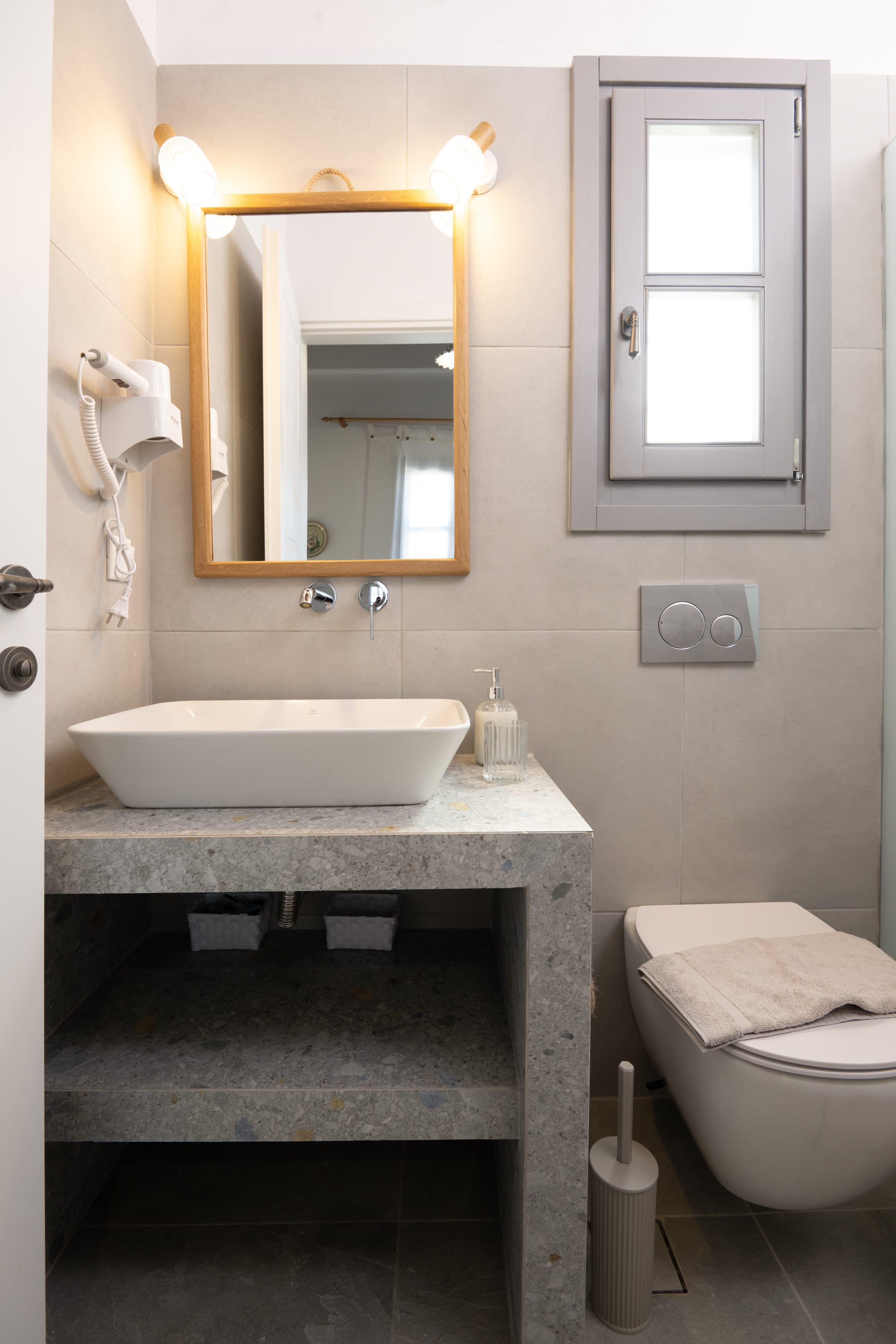 a bathroom with a sink and a toilet