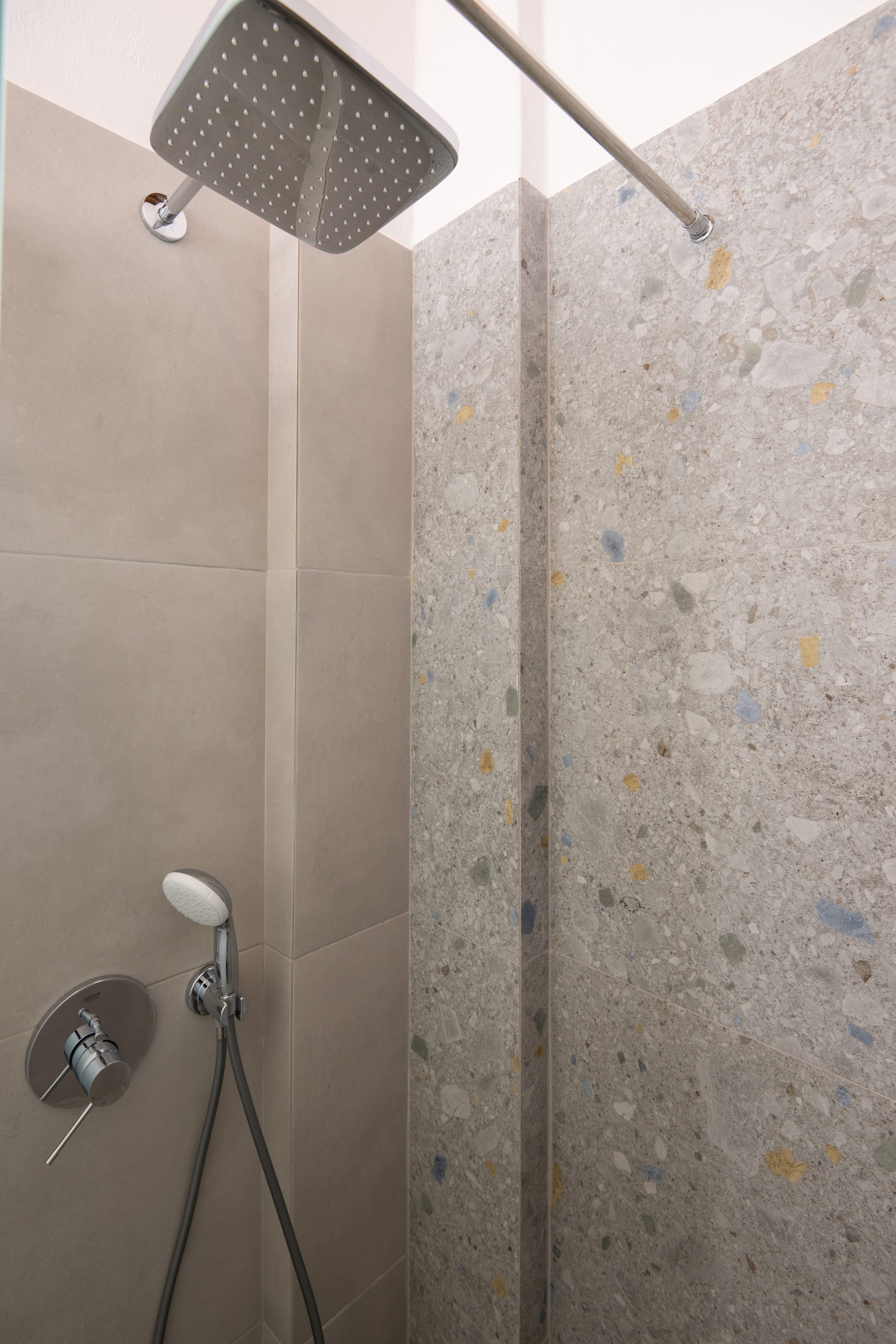 a shower head in a bathroom