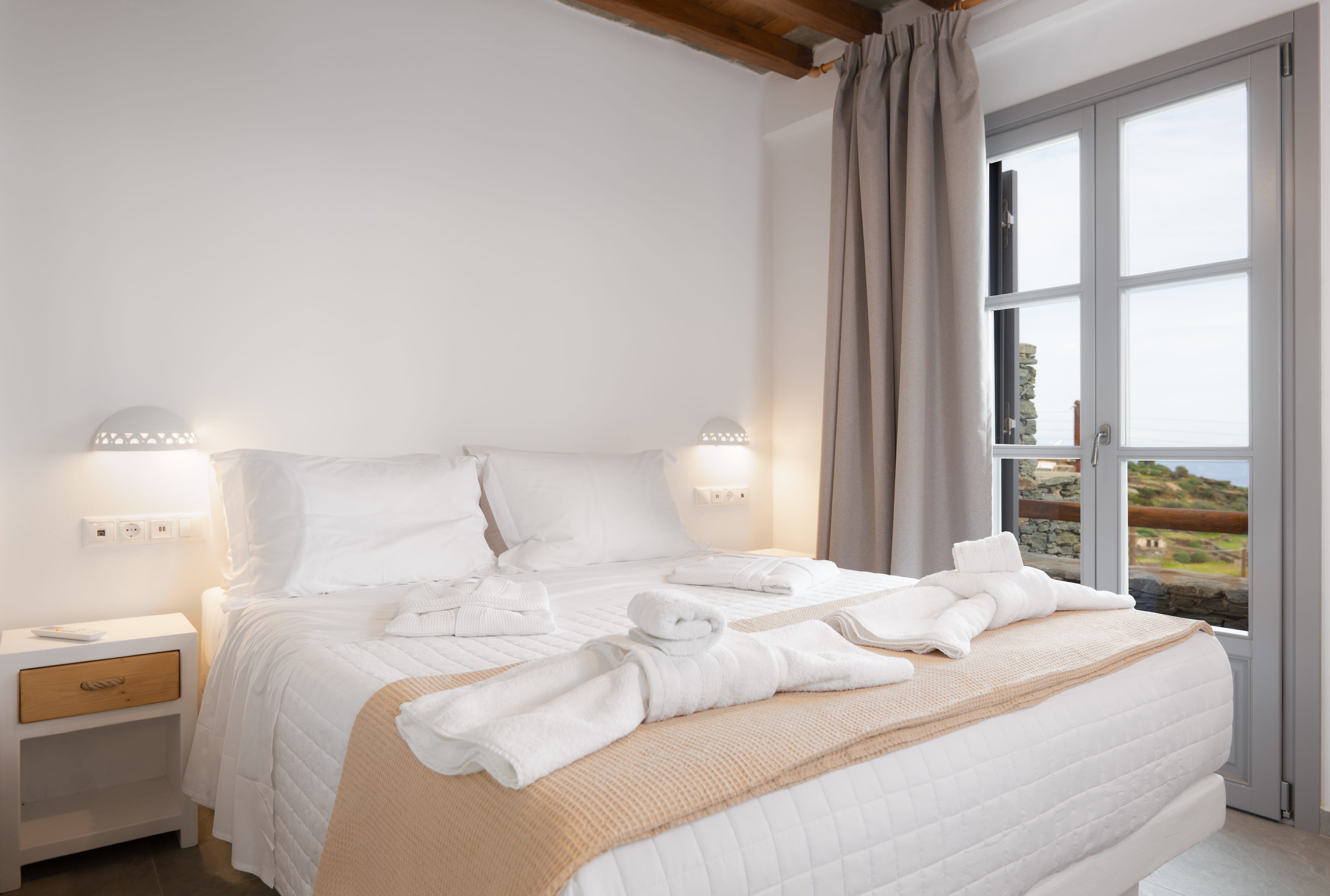 a bed with towels folded on it