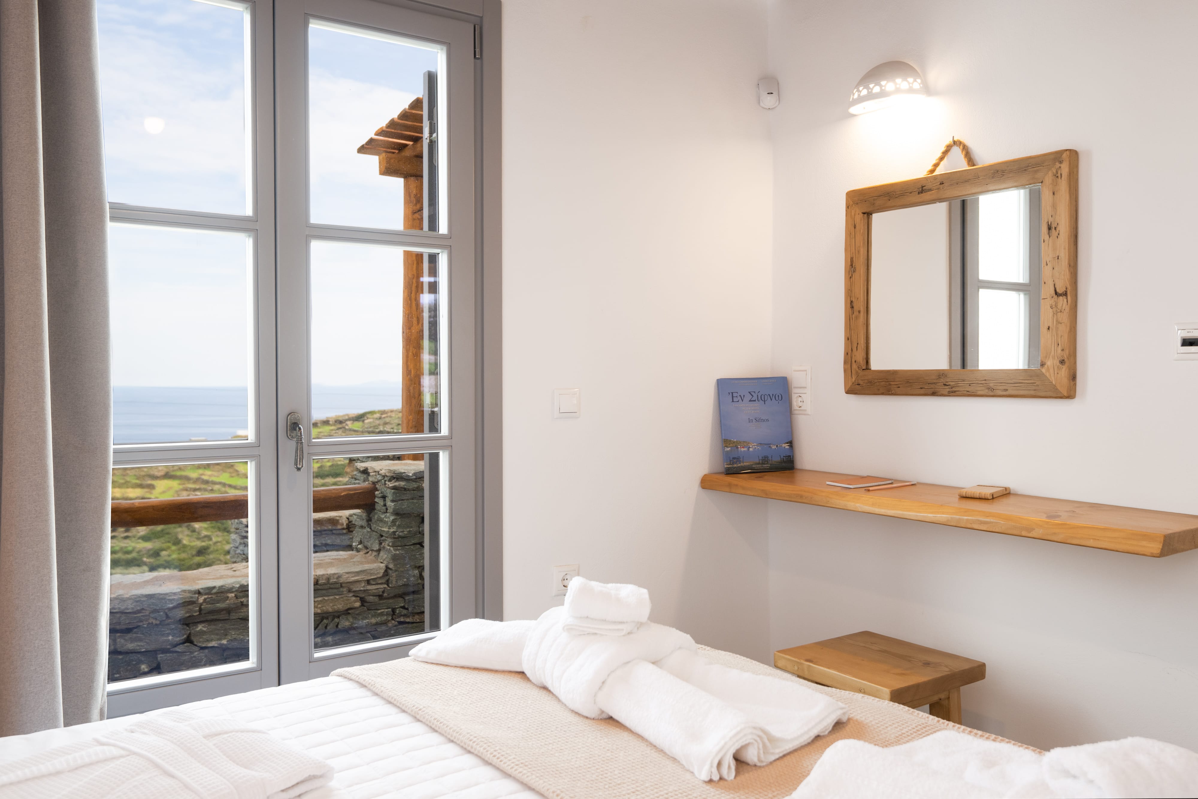 a bedroom with a mirror and a bed