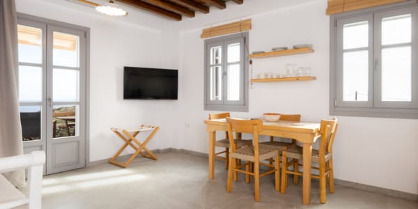 a room with a table and chairs