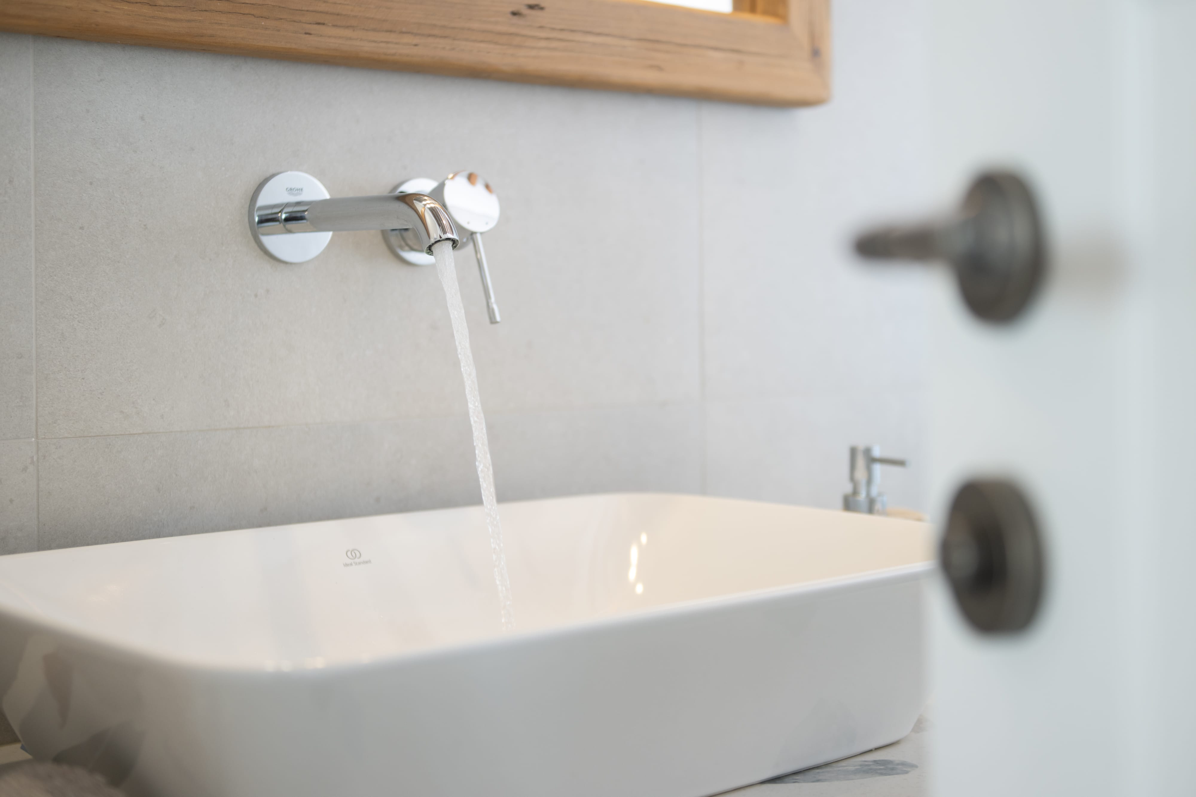 a faucet and sink with water running